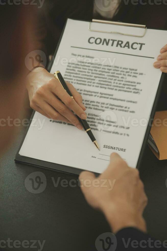 Business and lawyers discussing contract papers with brass scale on desk in office. Law, legal services, advice, justice and law concept picture with film grain effect photo