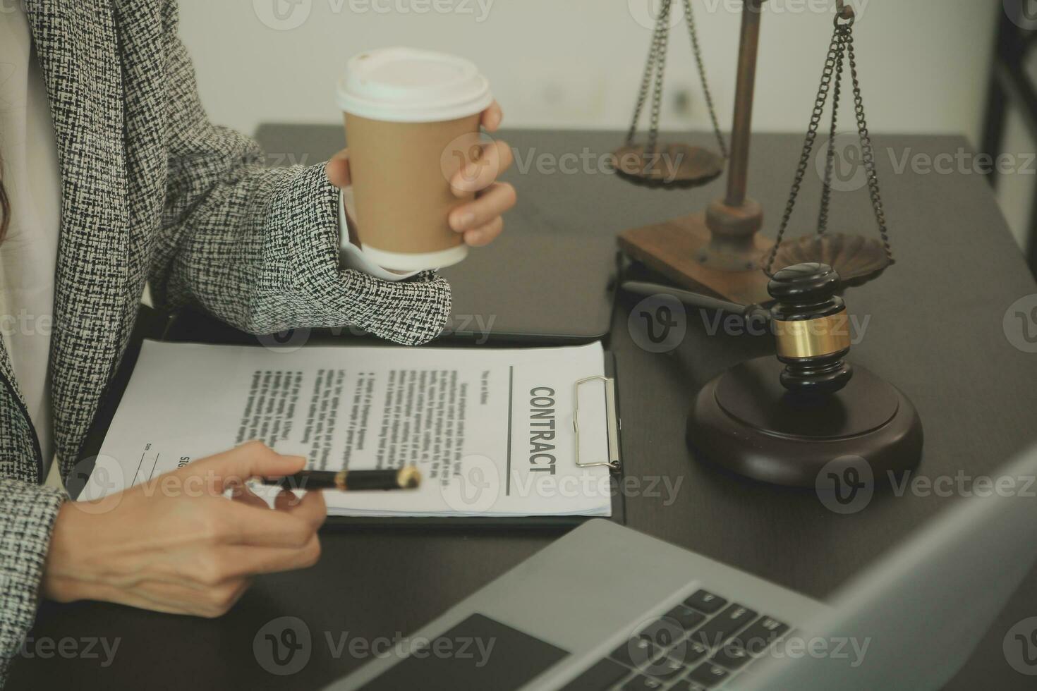 Business and lawyers discussing contract papers with brass scale on desk in office. Law, legal services, advice, justice and law concept picture with film grain effect photo