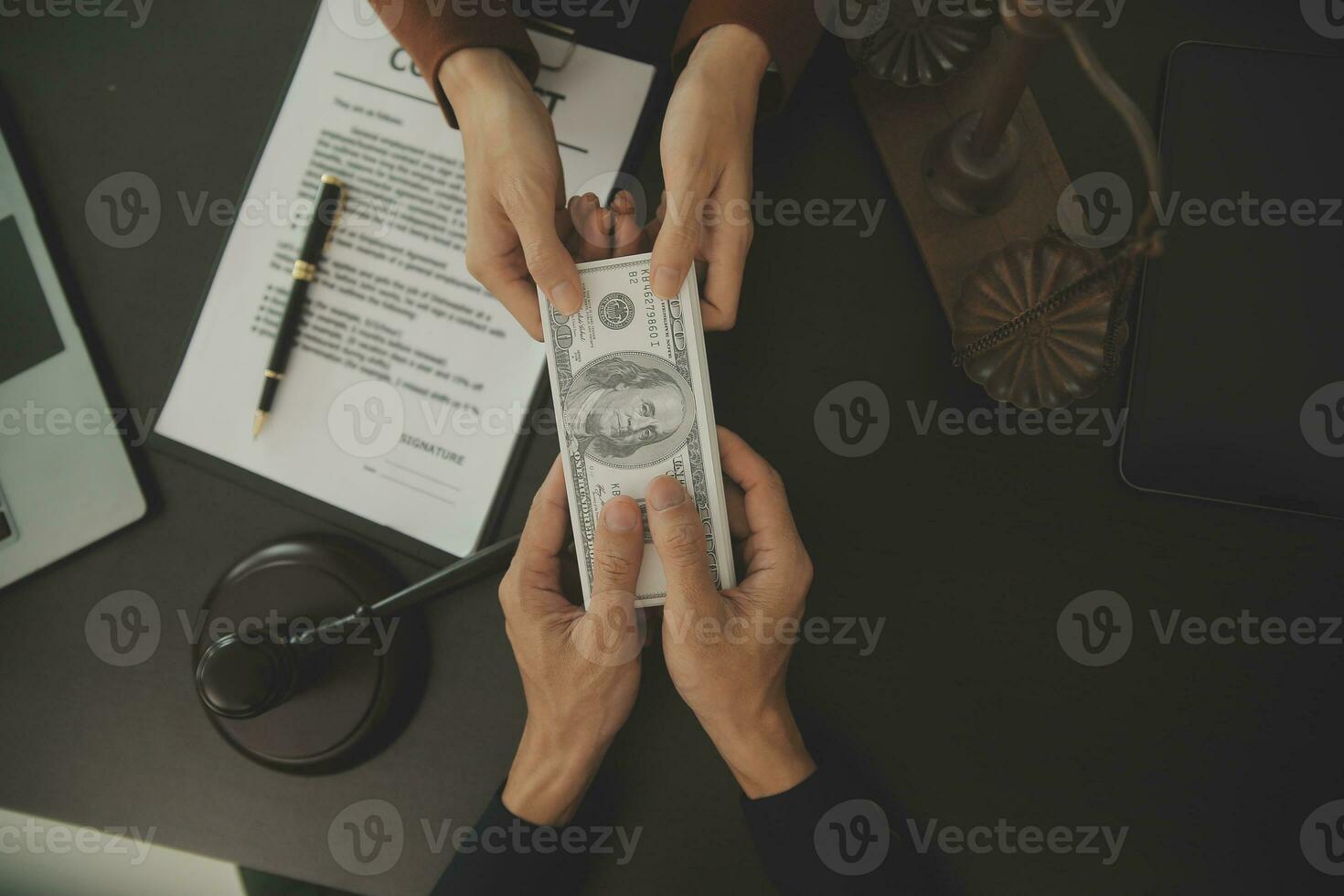 Business and lawyers discussing contract papers with brass scale on desk in office. Law, legal services, advice, justice and law concept picture with film grain effect photo