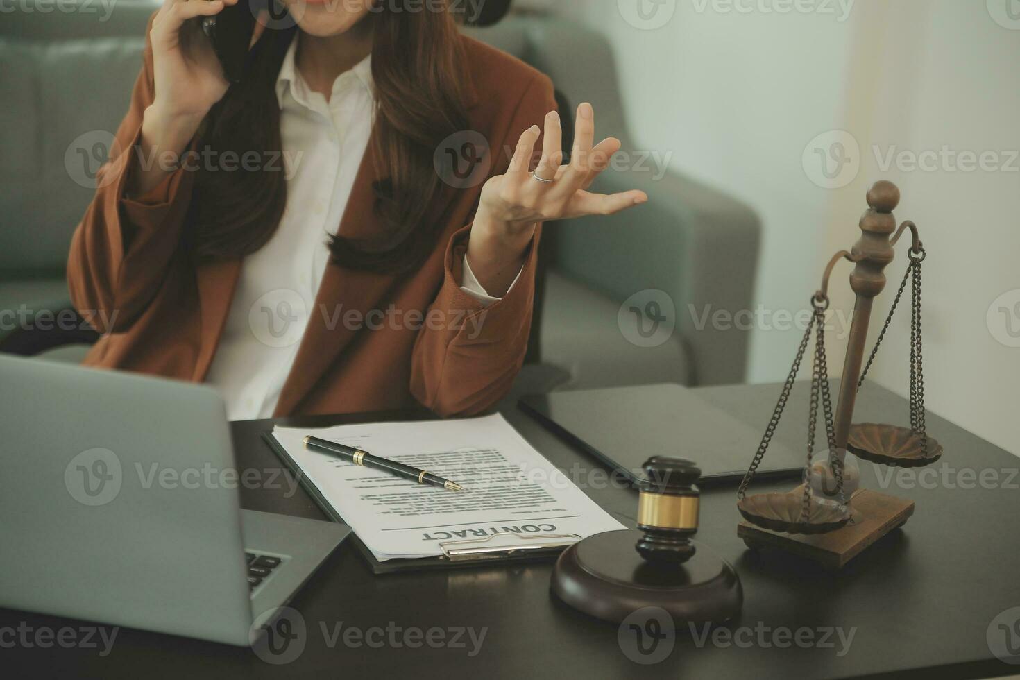 Business and lawyers discussing contract papers with brass scale on desk in office. Law, legal services, advice, justice and law concept picture with film grain effect photo