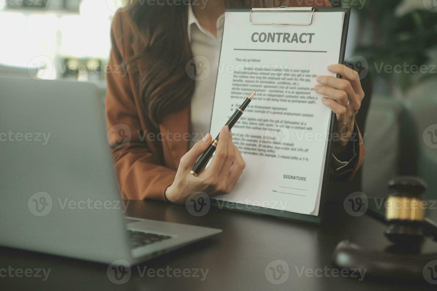 Business and lawyers discussing contract papers with brass scale on desk in office. Law, legal services, advice, justice and law concept picture with film grain effect photo