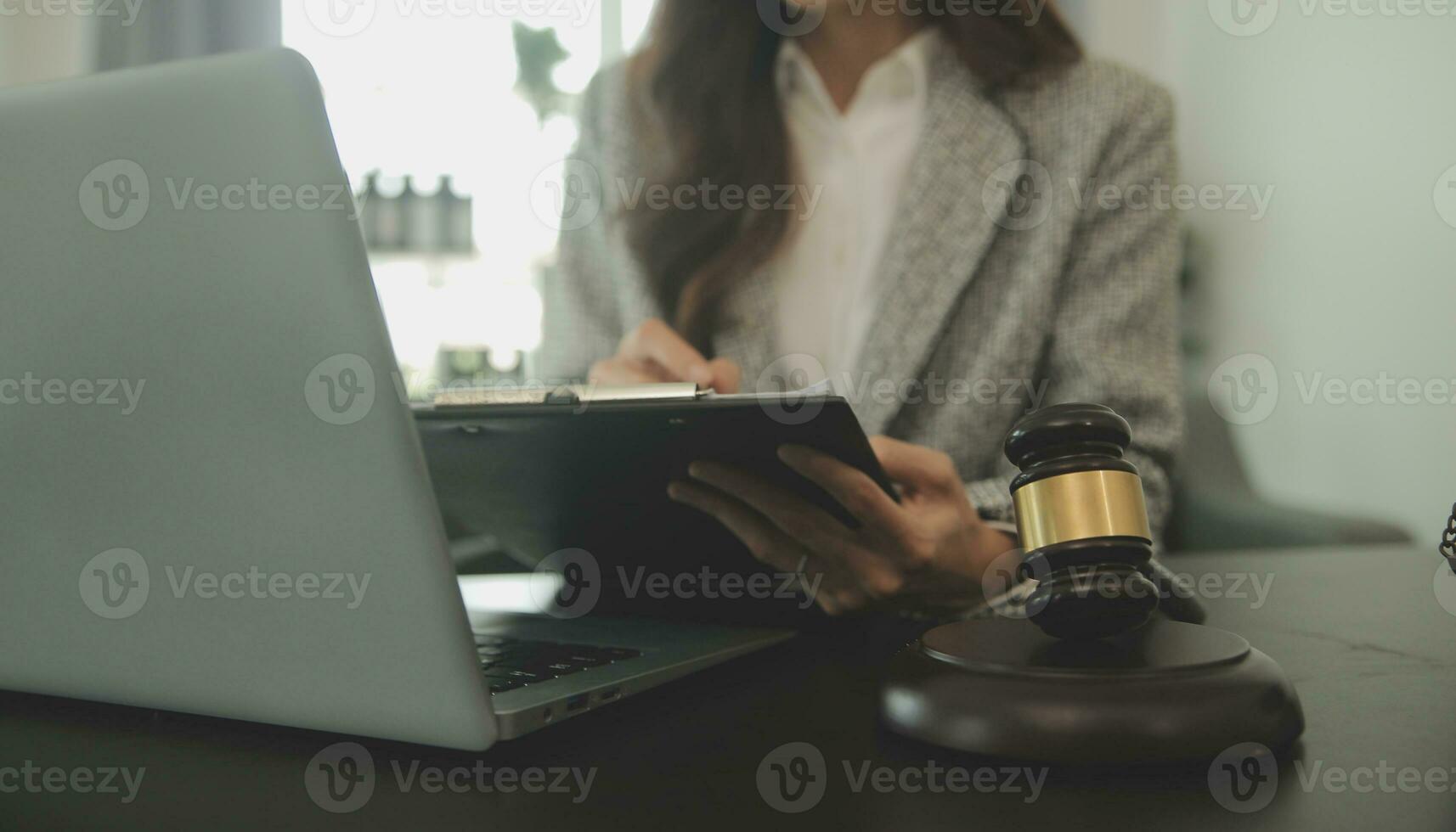 Business and lawyers discussing contract papers with brass scale on desk in office. Law, legal services, advice, justice and law concept picture with film grain effect photo