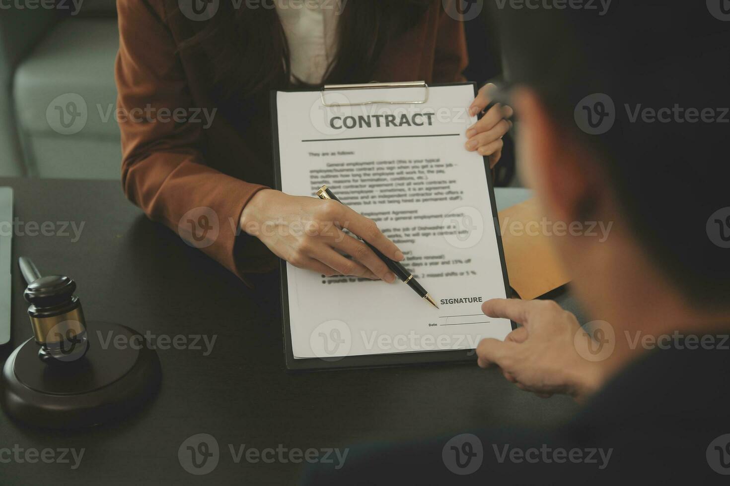 Business and lawyers discussing contract papers with brass scale on desk in office. Law, legal services, advice, justice and law concept picture with film grain effect photo