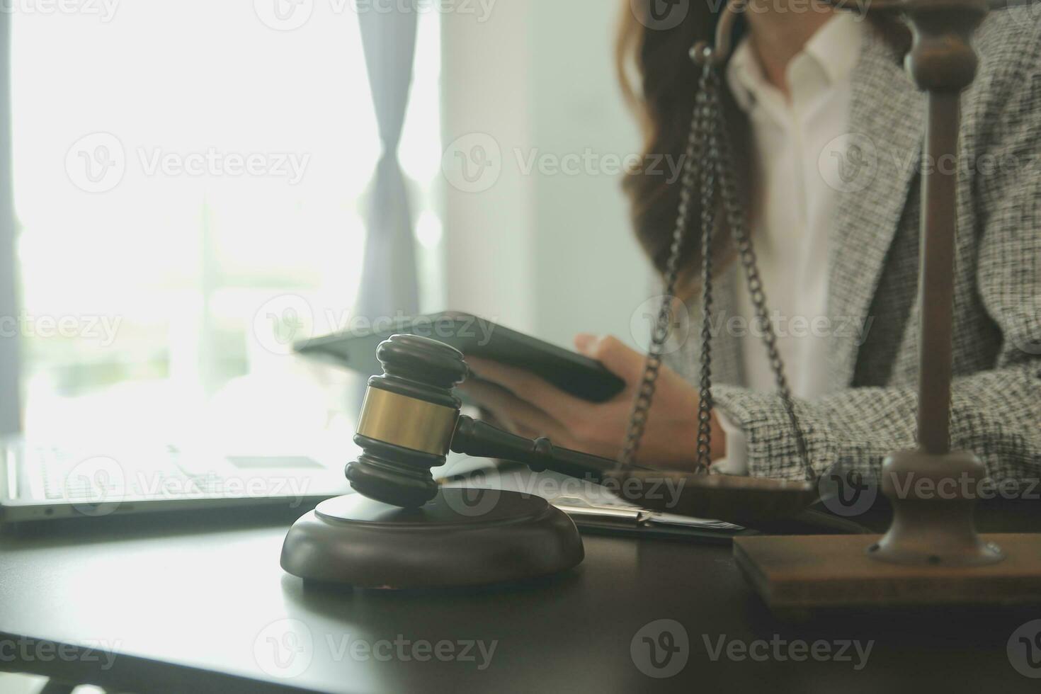Business and lawyers discussing contract papers with brass scale on desk in office. Law, legal services, advice, justice and law concept picture with film grain effect photo