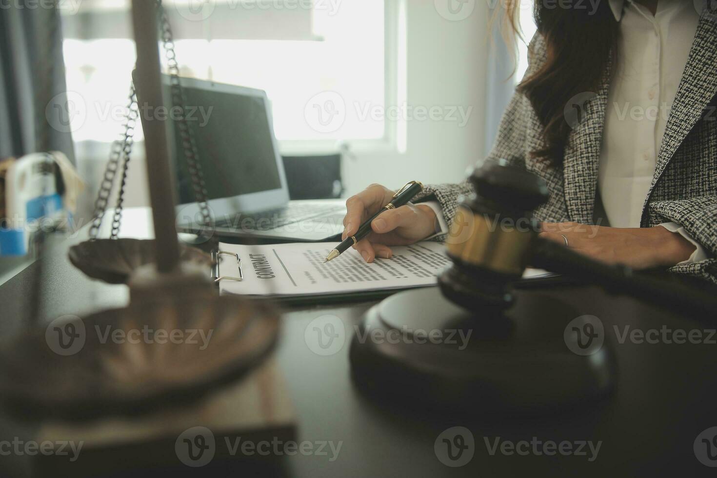 Business and lawyers discussing contract papers with brass scale on desk in office. Law, legal services, advice, justice and law concept picture with film grain effect photo