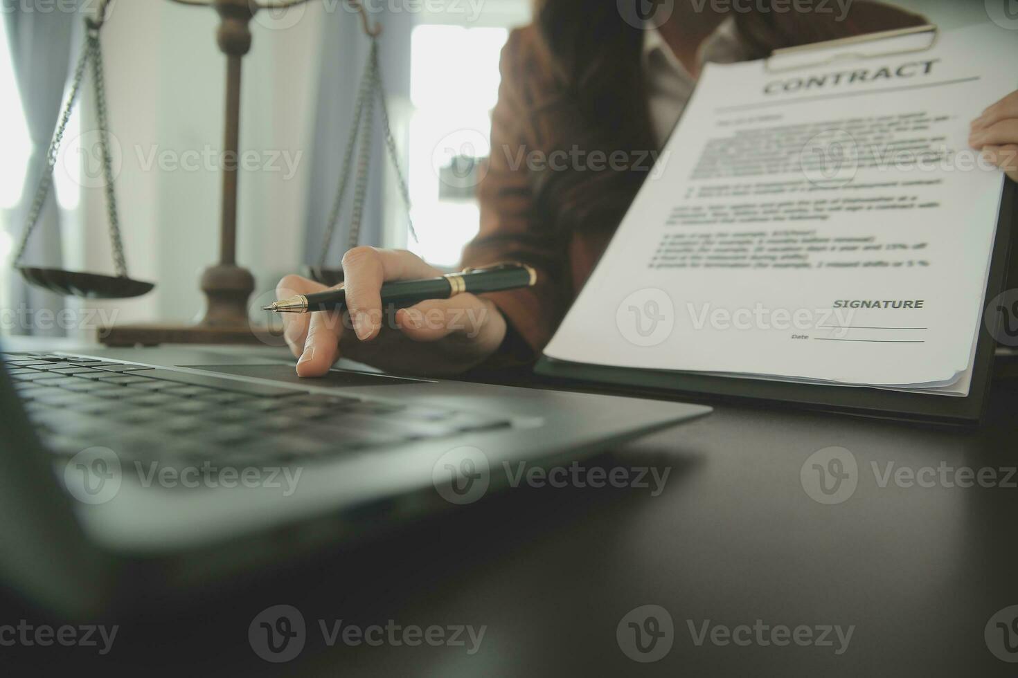 Business and lawyers discussing contract papers with brass scale on desk in office. Law, legal services, advice, justice and law concept picture with film grain effect photo