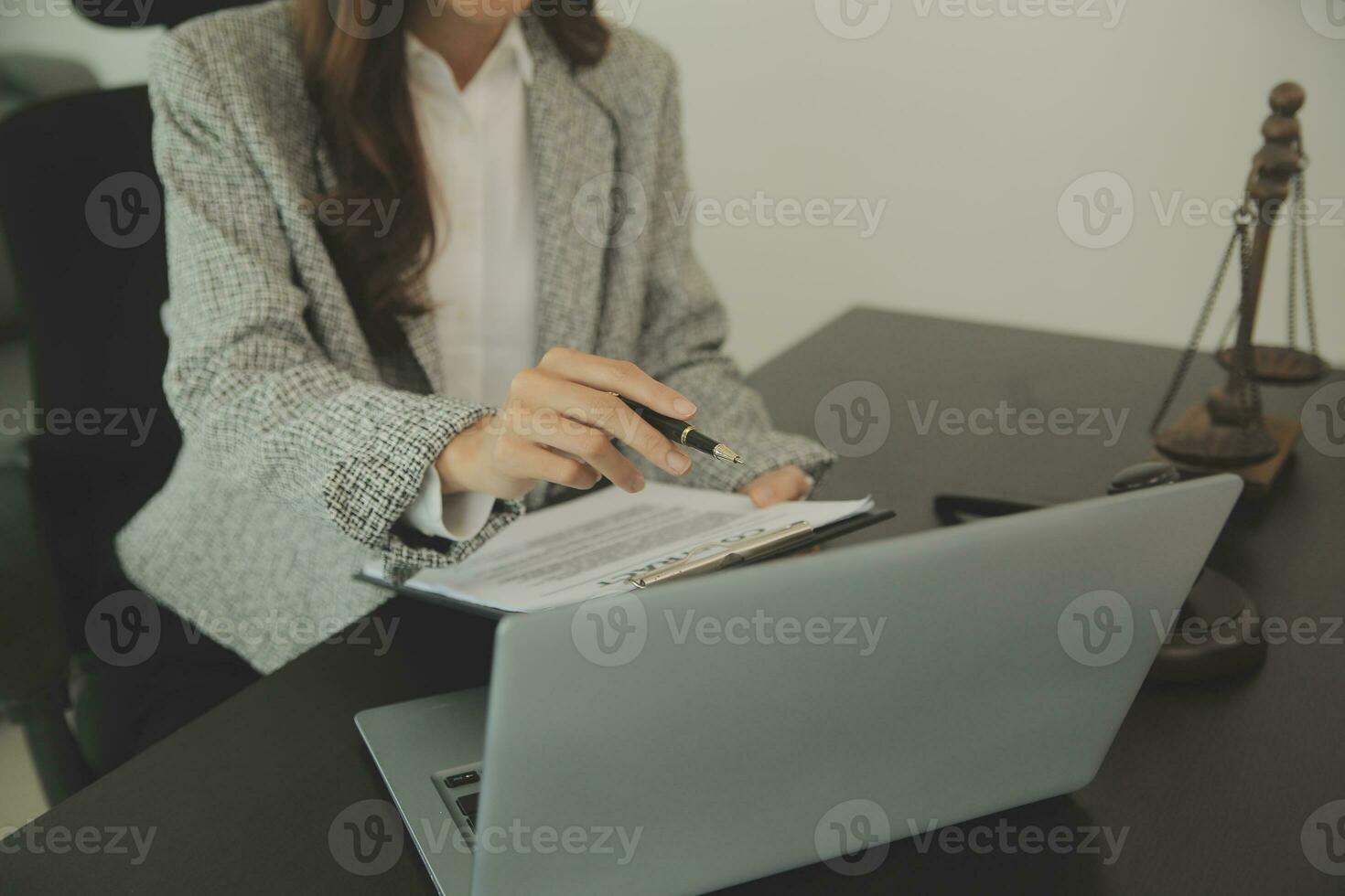 Business and lawyers discussing contract papers with brass scale on desk in office. Law, legal services, advice, justice and law concept picture with film grain effect photo