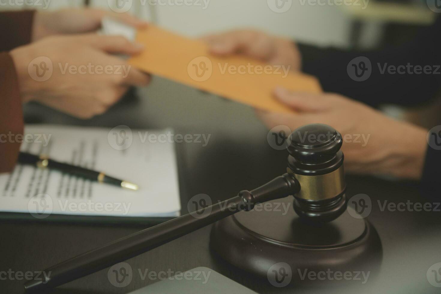 Business and lawyers discussing contract papers with brass scale on desk in office. Law, legal services, advice, justice and law concept picture with film grain effect photo