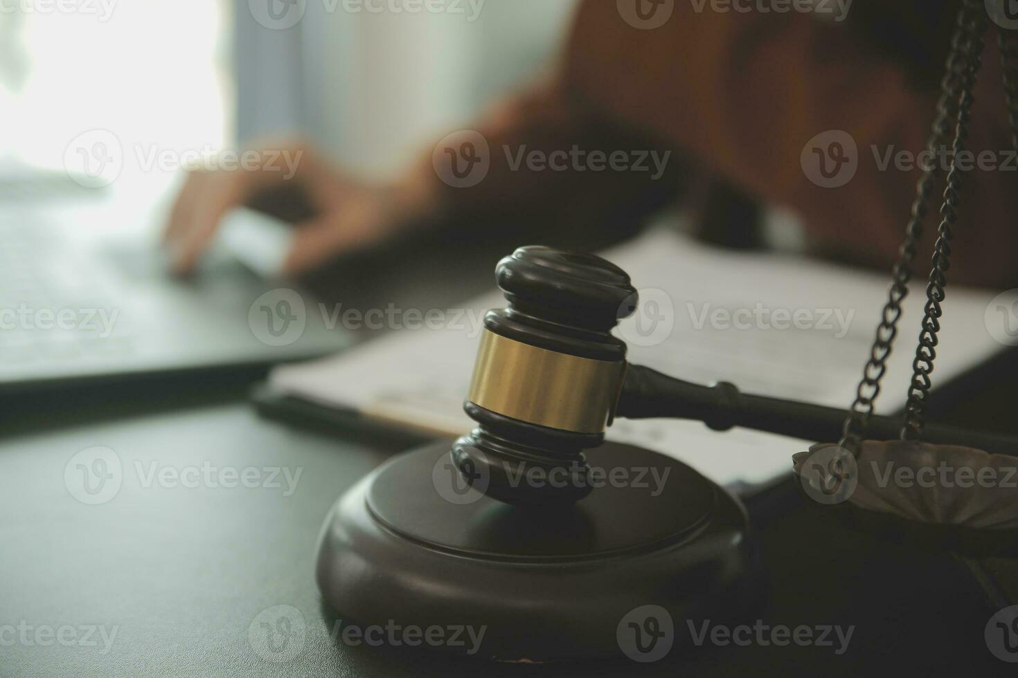 Business and lawyers discussing contract papers with brass scale on desk in office. Law, legal services, advice, justice and law concept picture with film grain effect photo