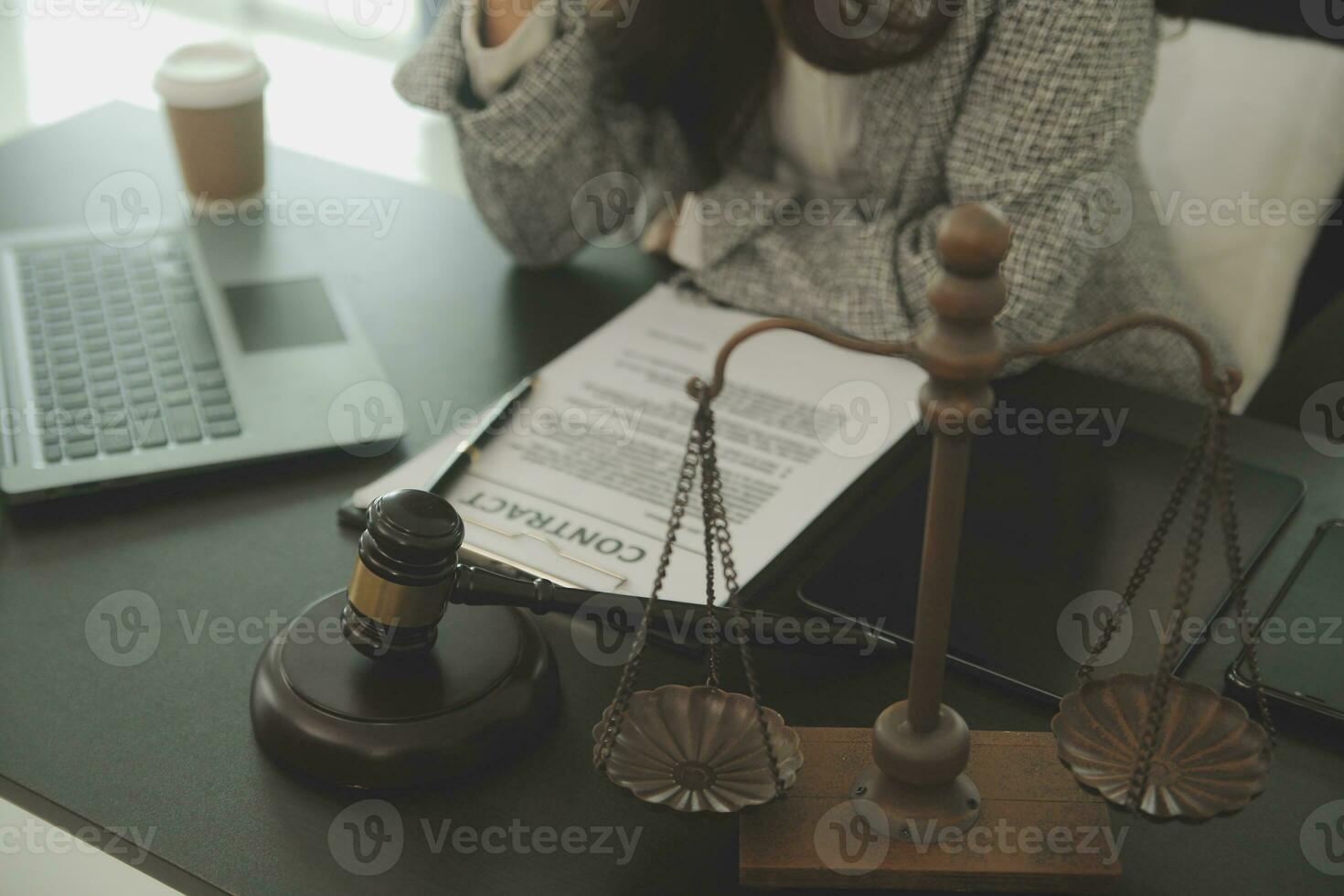Business and lawyers discussing contract papers with brass scale on desk in office. Law, legal services, advice, justice and law concept picture with film grain effect photo