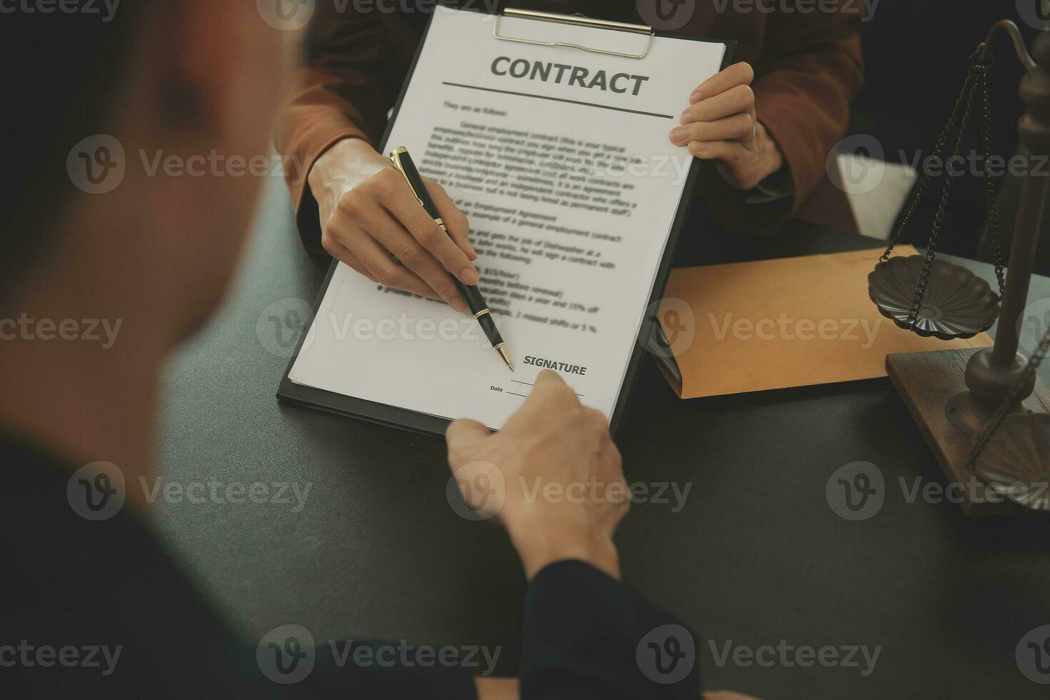 Business and lawyers discussing contract papers with brass scale on desk in office. Law, legal services, advice, justice and law concept picture with film grain effect photo