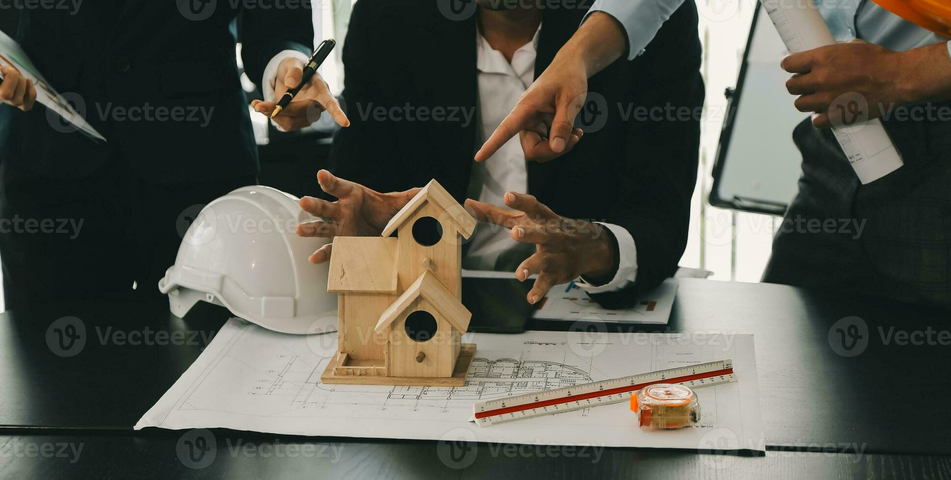 Construction and structure concept of Engineer or architect meeting for project working with partner and engineering tools on model building and blueprint in working site, contract for both companies. photo
