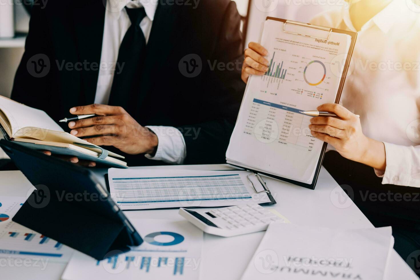 businessman working on desk office with using a calculator to calculate the numbers, finance accounting concept photo