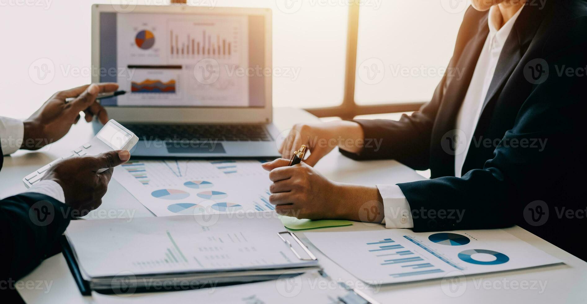 businessman working on desk office with using a calculator to calculate the numbers, finance accounting concept photo
