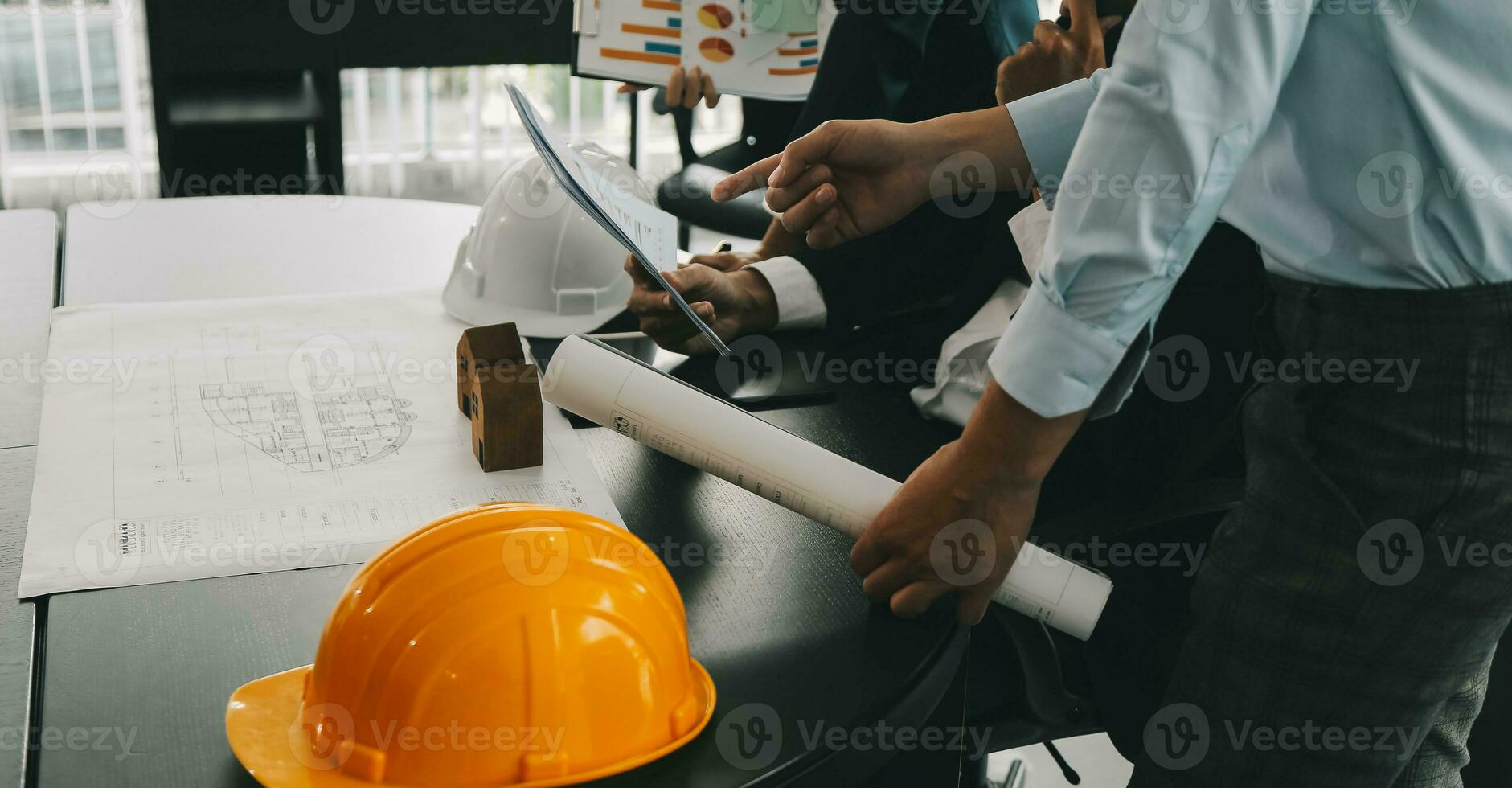 Construction and structure concept of Engineer or architect meeting for project working with partner and engineering tools on model building and blueprint in working site, contract for both companies. photo