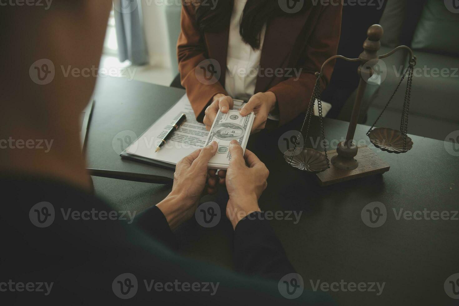 Business and lawyers discussing contract papers with brass scale on desk in office. Law, legal services, advice, justice and law concept picture with film grain effect photo