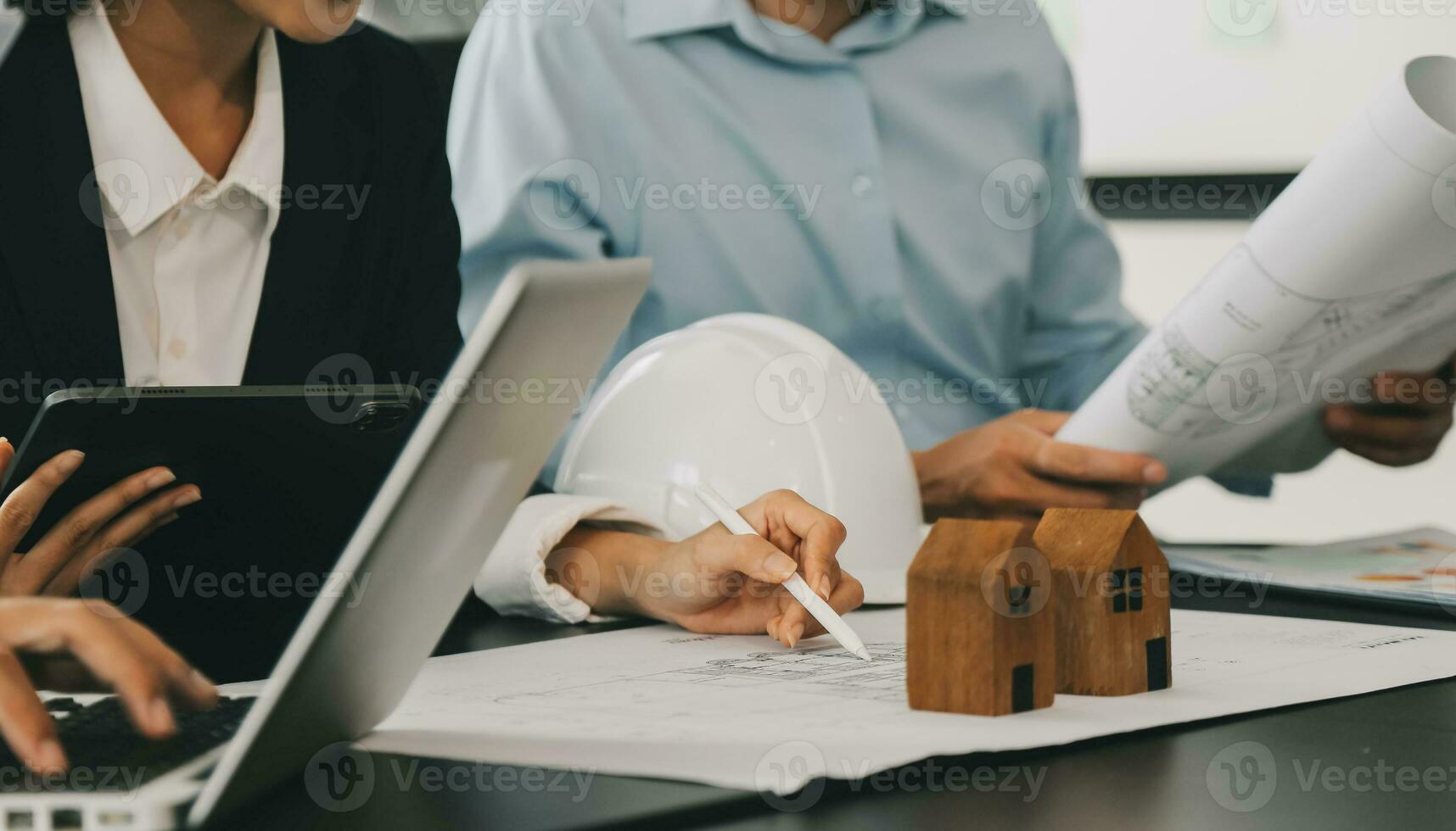 Construction and structure concept of Engineer or architect meeting for project working with partner and engineering tools on model building and blueprint in working site, contract for both companies. photo