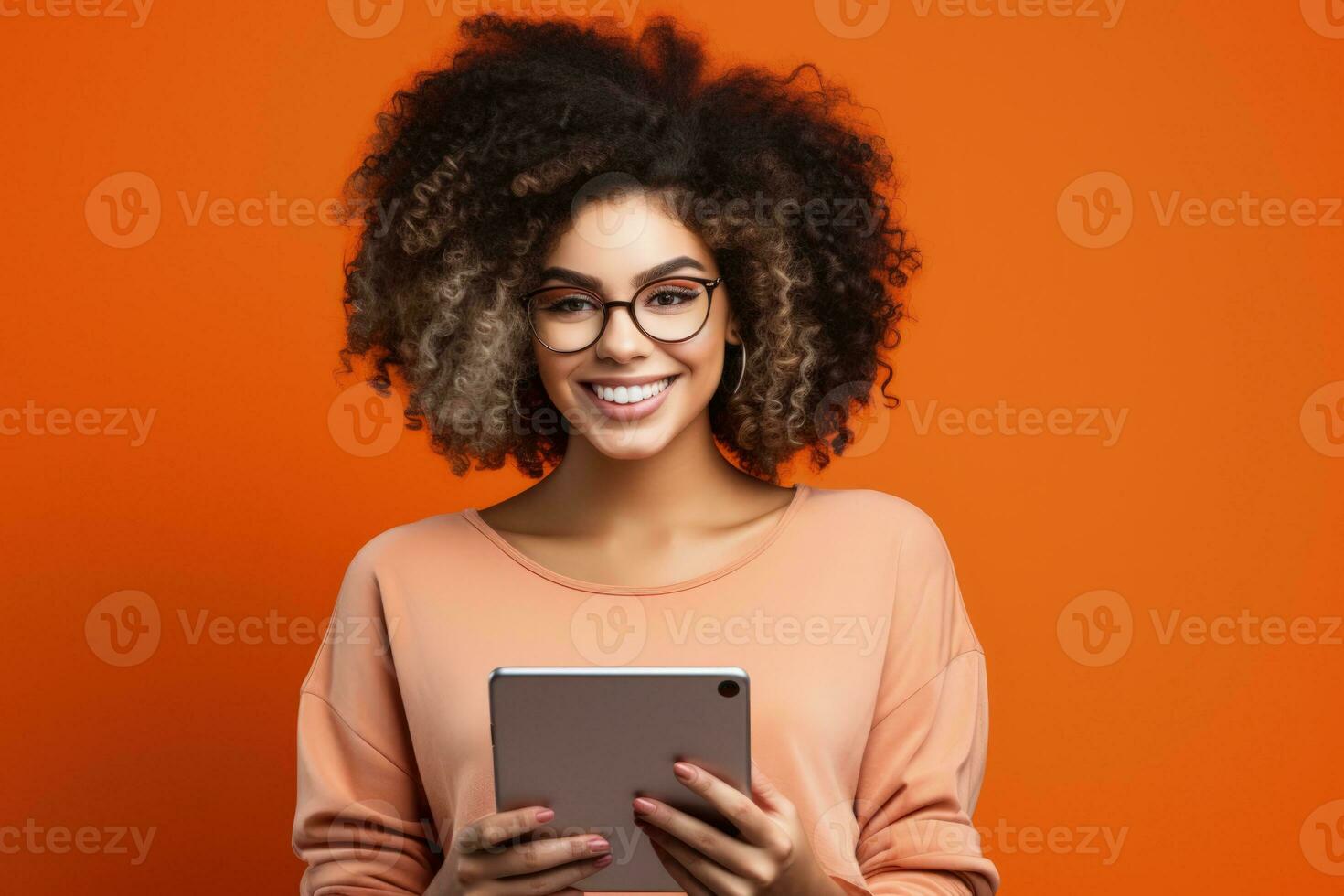 Gen Z individual with digital tablet isolated on a vibrant coral gradient background photo