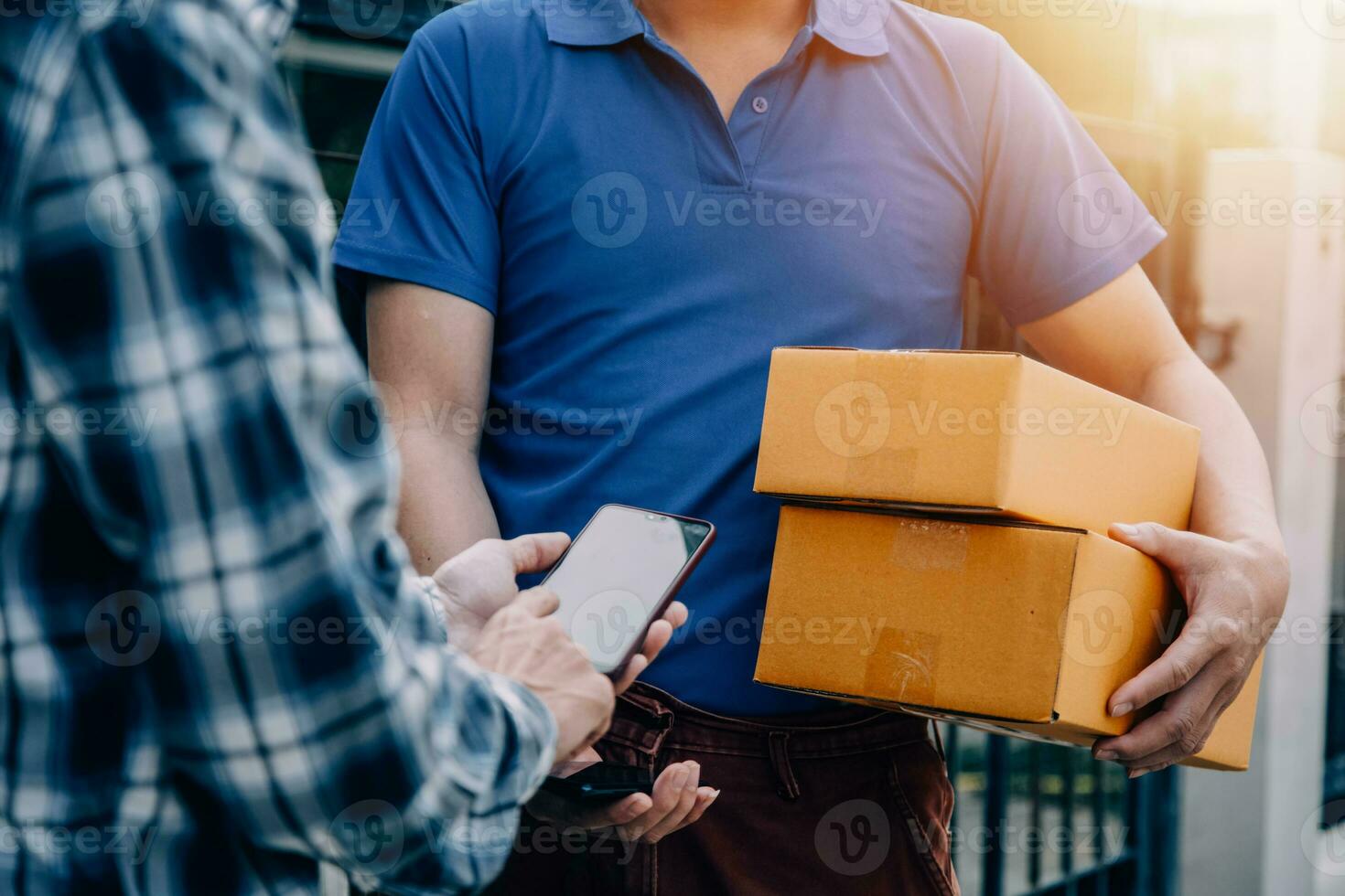 Entrepreneurs Small Business SME Independent men work at home Use smartphones and laptops for commercial checking, online marketing, packing boxes, SME sellers, concept, e-commerce team, online sales photo