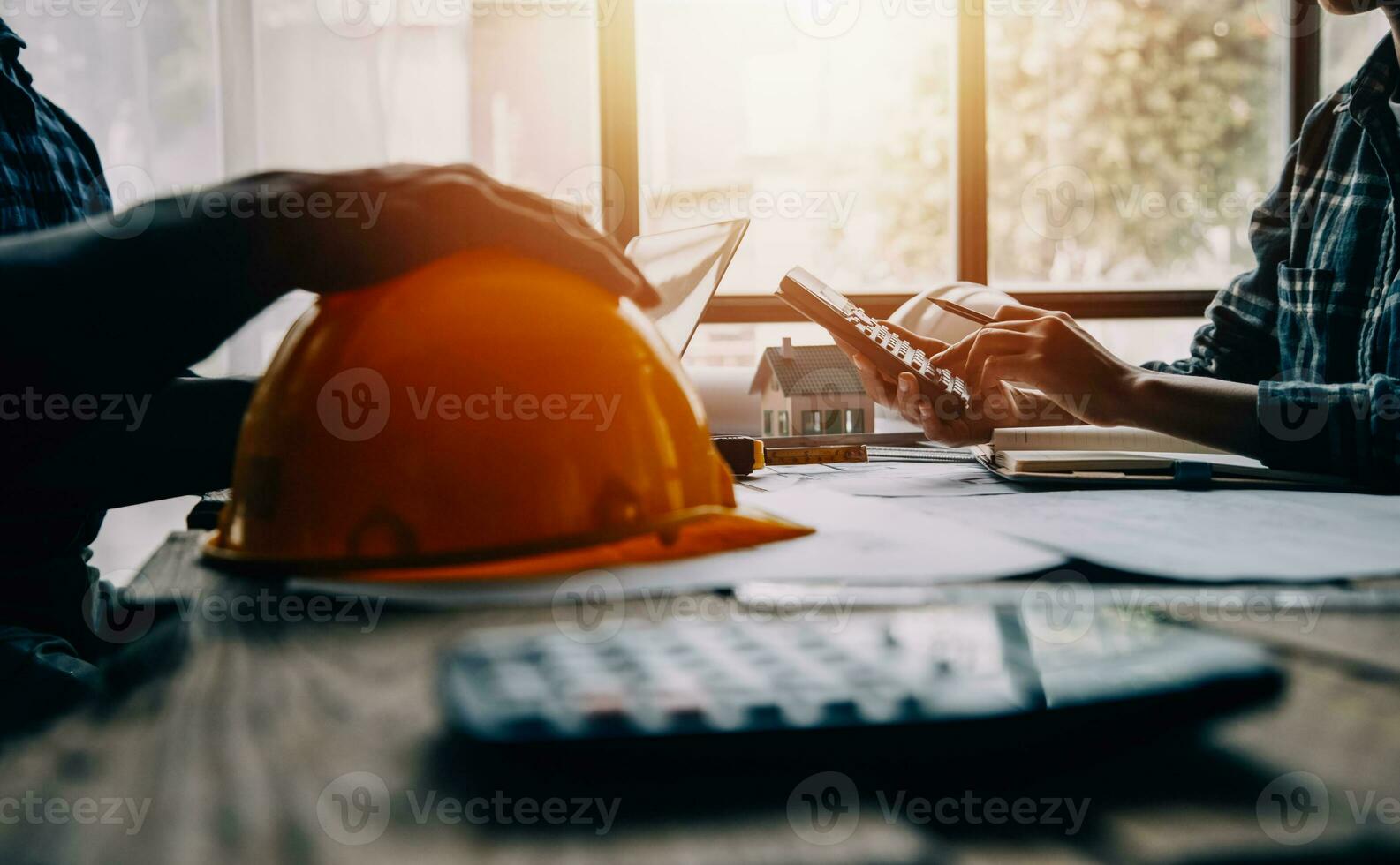 Construction and structure concept of engineer working drawing on blueprint meeting for project working with partner on model building and engineering tools in working site, construction concept photo