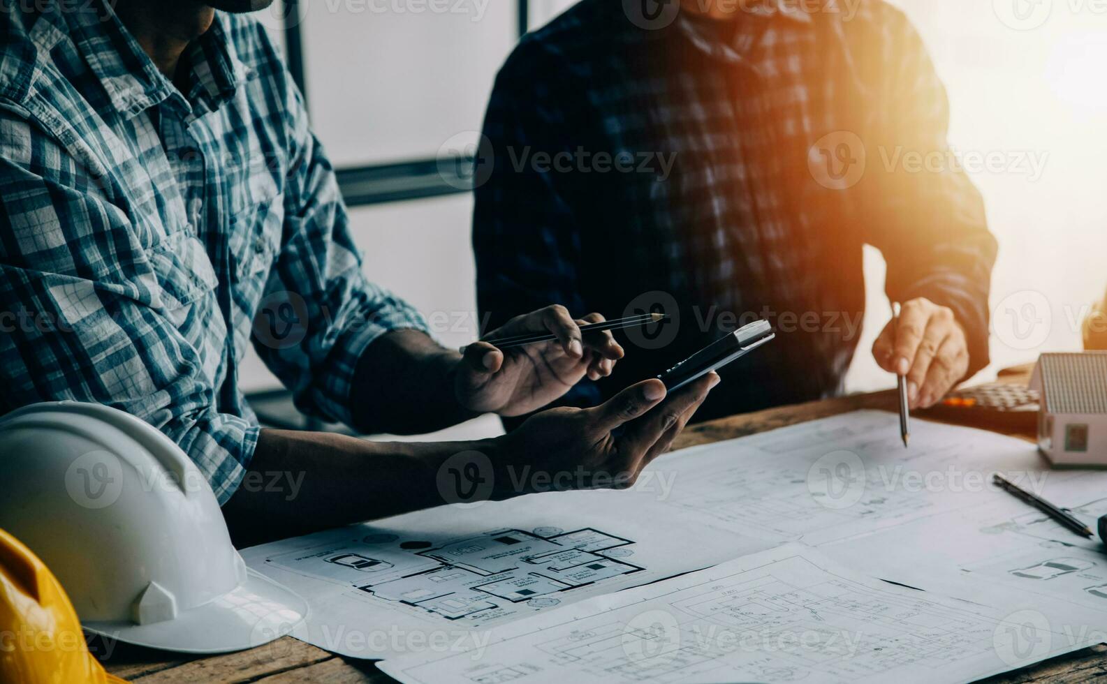 Construction and structure concept of engineer working drawing on blueprint meeting for project working with partner on model building and engineering tools in working site, construction concept photo