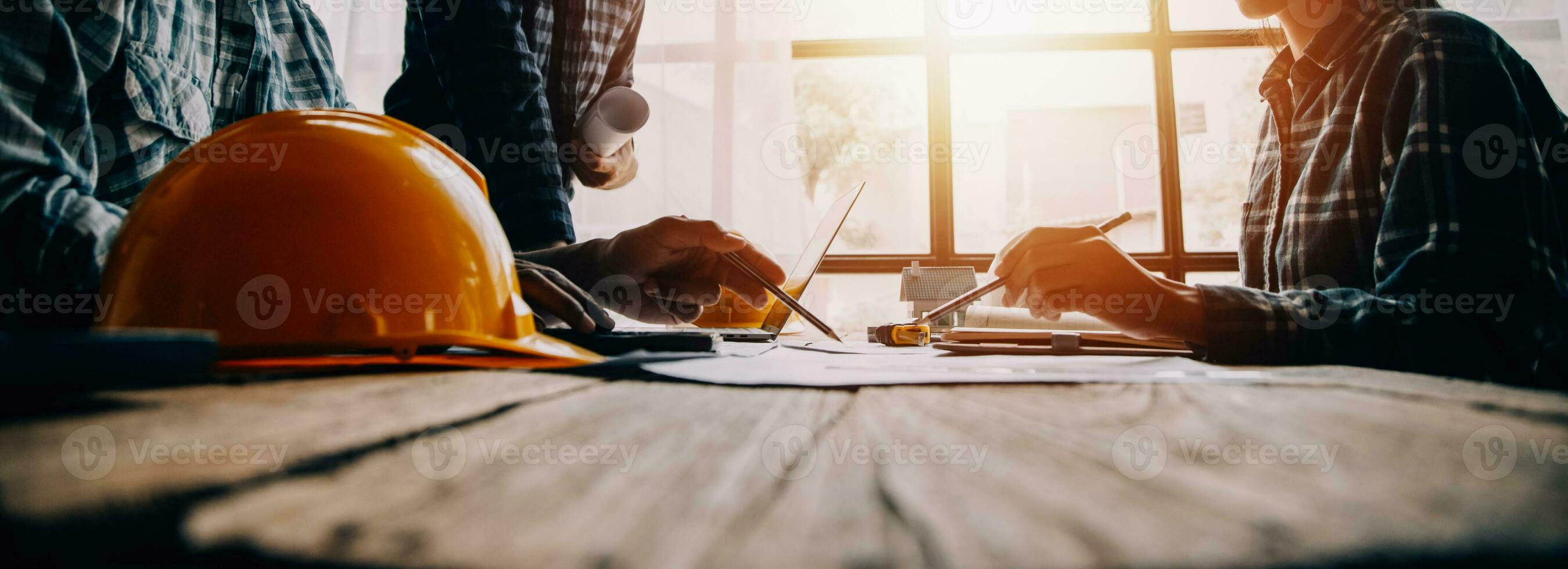 Construction and structure concept of engineer working drawing on blueprint meeting for project working with partner on model building and engineering tools in working site, construction concept photo