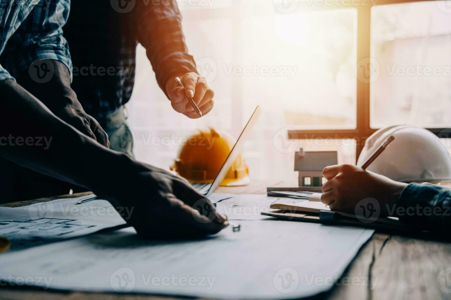 Construction and structure concept of engineer working drawing on blueprint meeting for project working with partner on model building and engineering tools in working site, construction concept photo