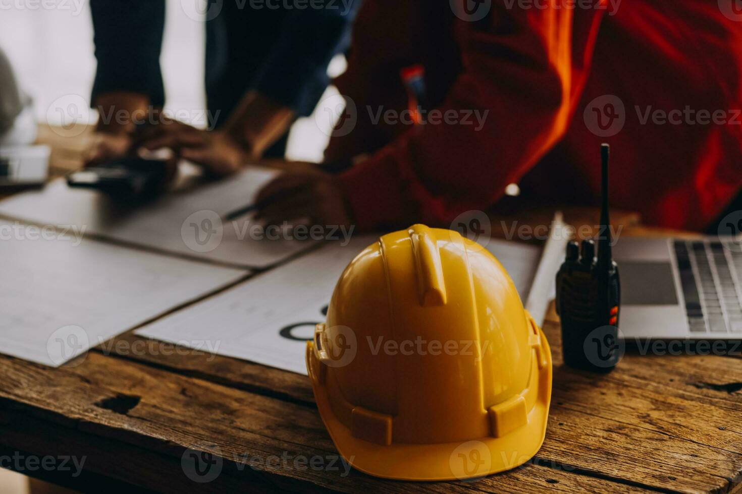 Construction concept of Engineer and Architect working at Construction Site with blue print photo