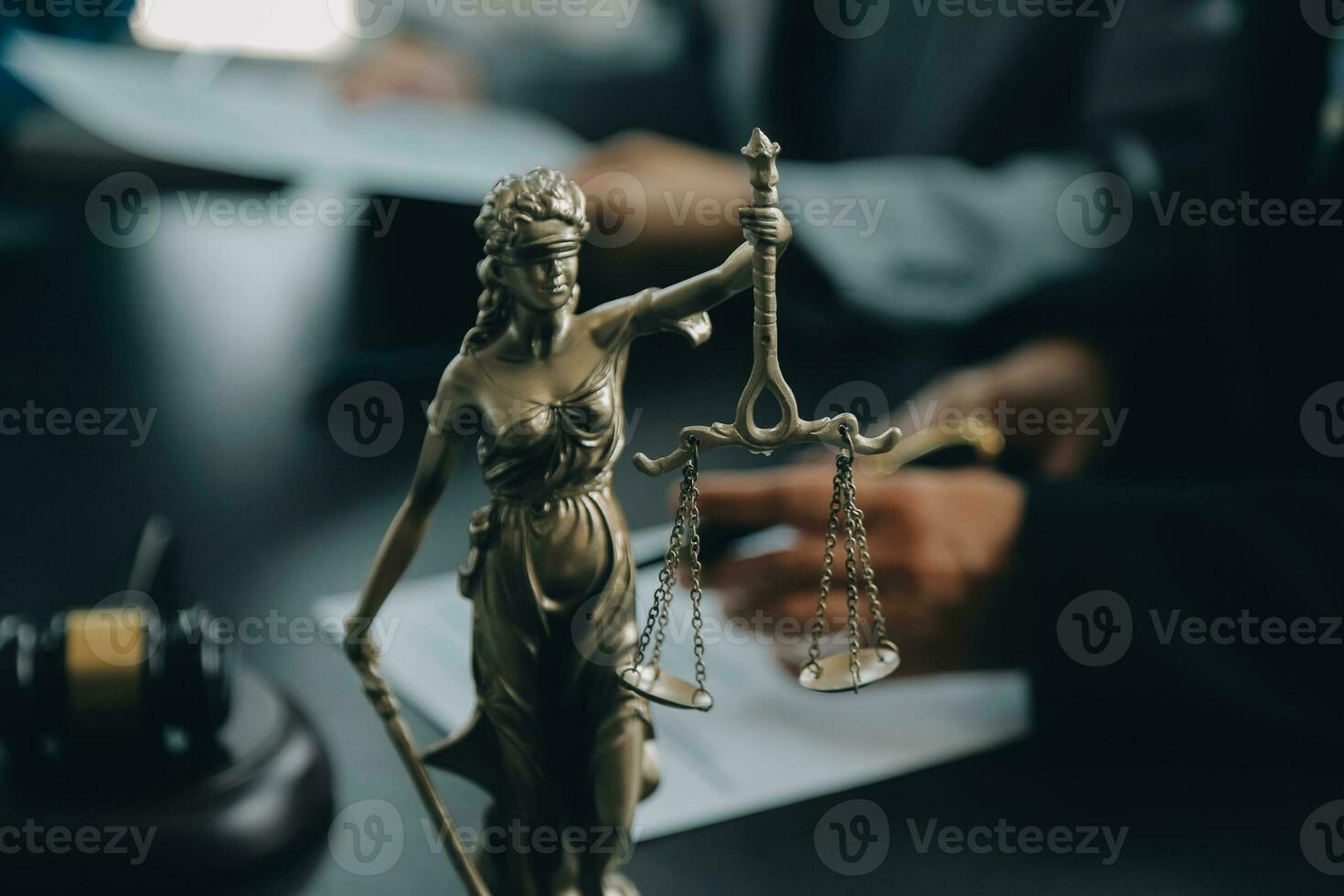Business and lawyers discussing contract papers with brass scale on desk in office. Law, legal services, advice, justice and law concept picture with film grain effect photo