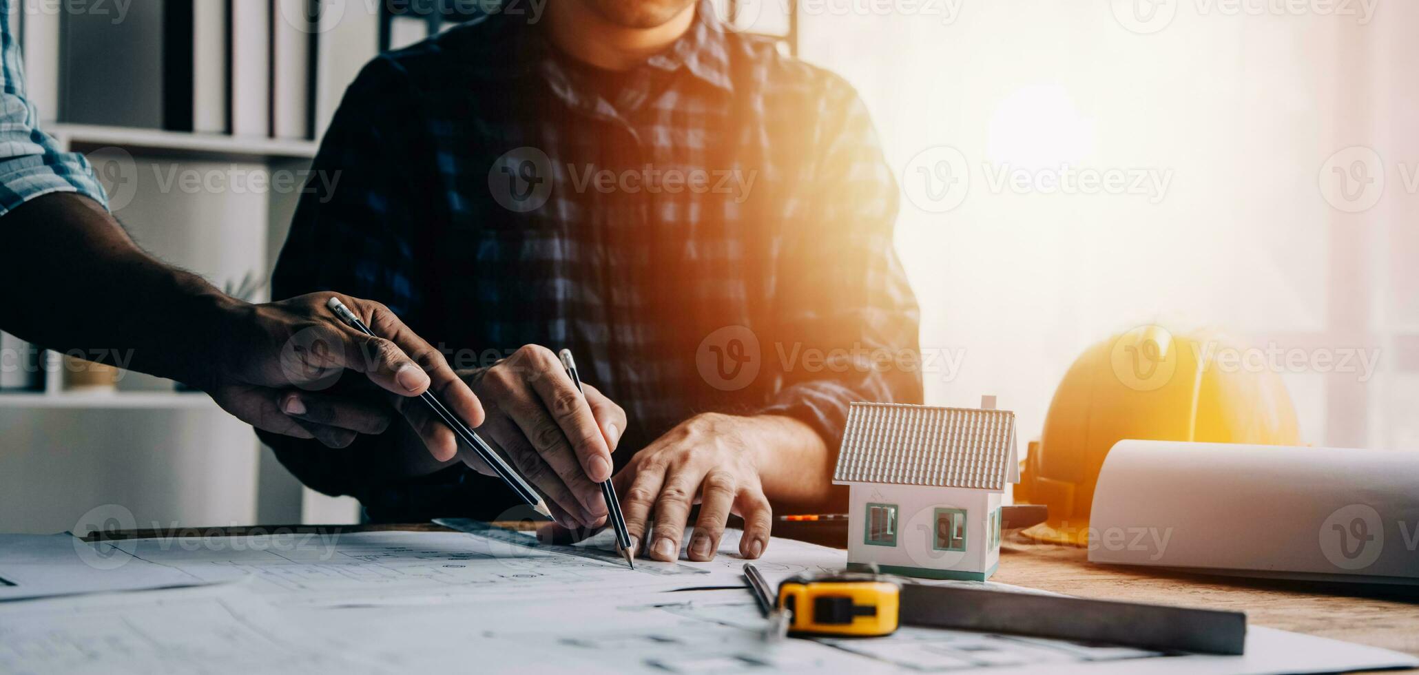 Construction and structure concept of engineer working drawing on blueprint meeting for project working with partner on model building and engineering tools in working site, construction concept photo