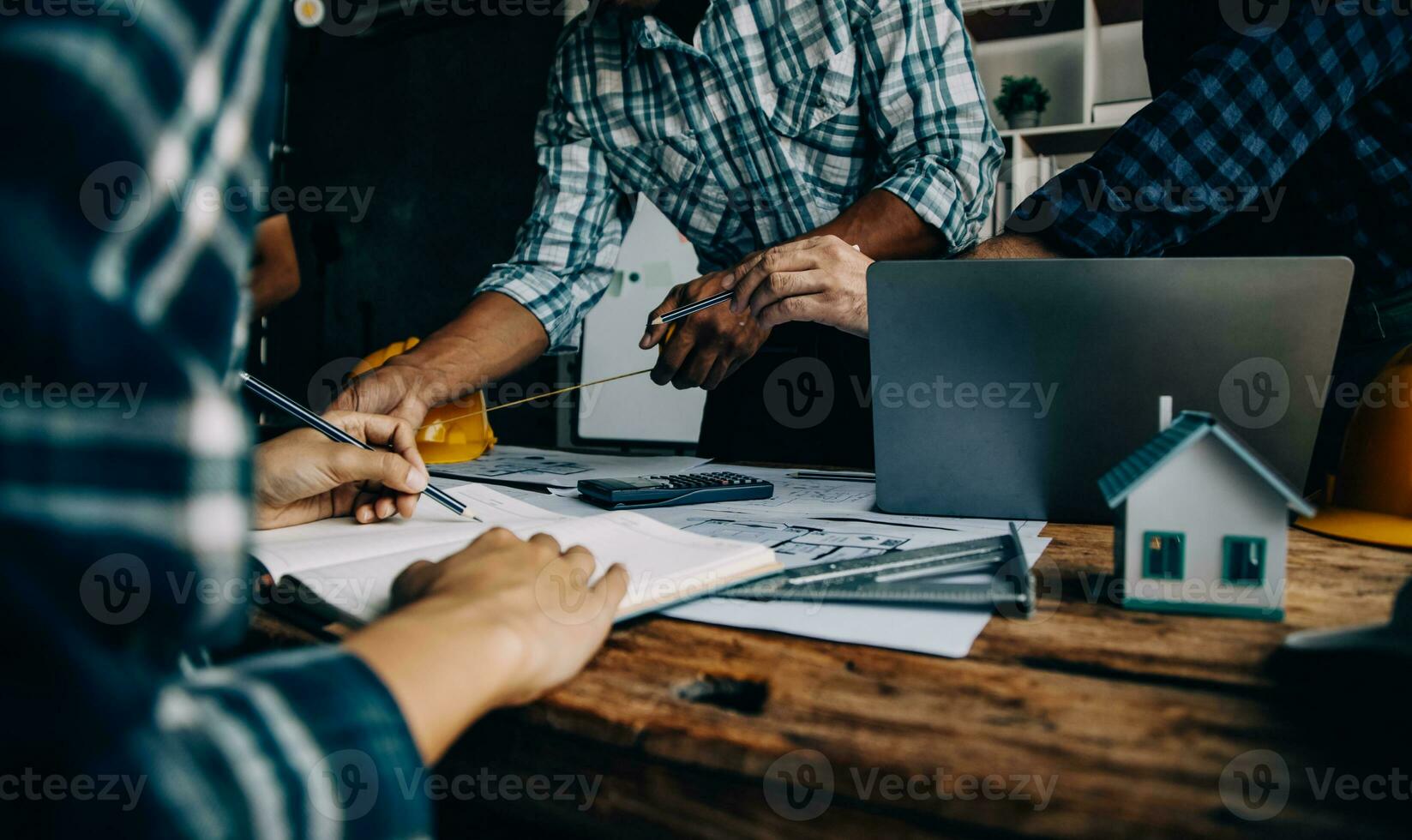 Construction and structure concept of engineer working drawing on blueprint meeting for project working with partner on model building and engineering tools in working site, construction concept photo