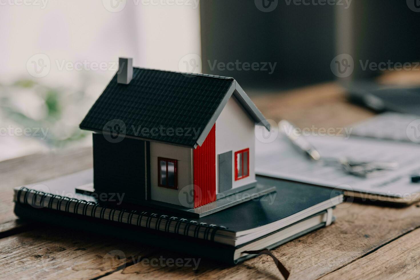 Real estate brokerage agent Deliver a sample of a model house to the customer, mortgage loan agreement Making lease and buying a house And contract home insurance concept photo