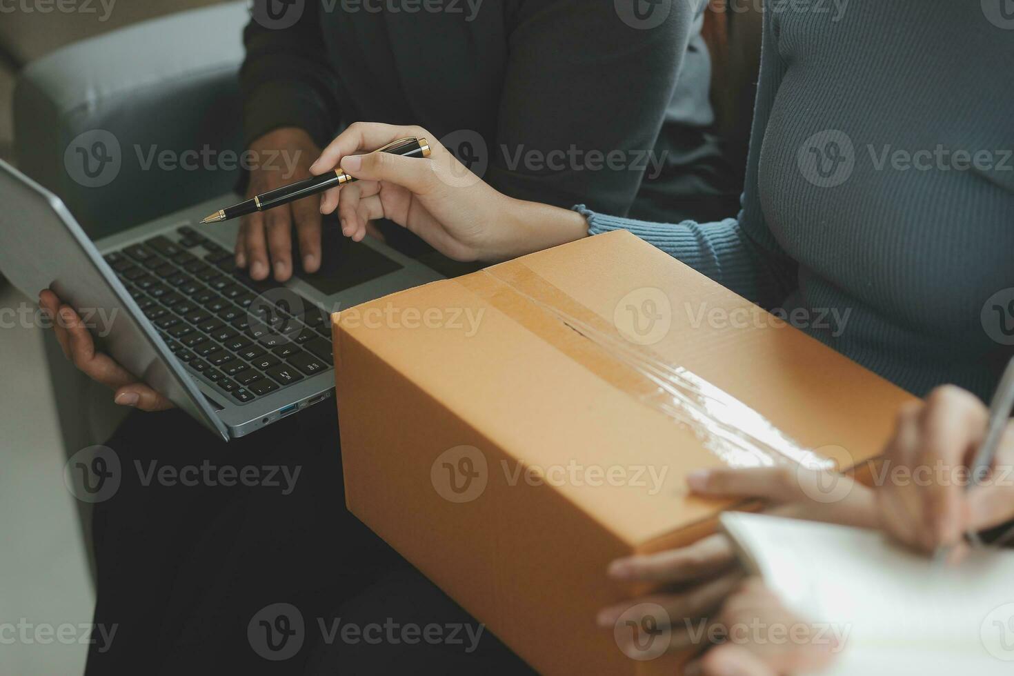 Business woman start up small business entrepreneur SME success .freelance woman working at home with Online Parcel delivery. SME and packaging deliveryconcept photo