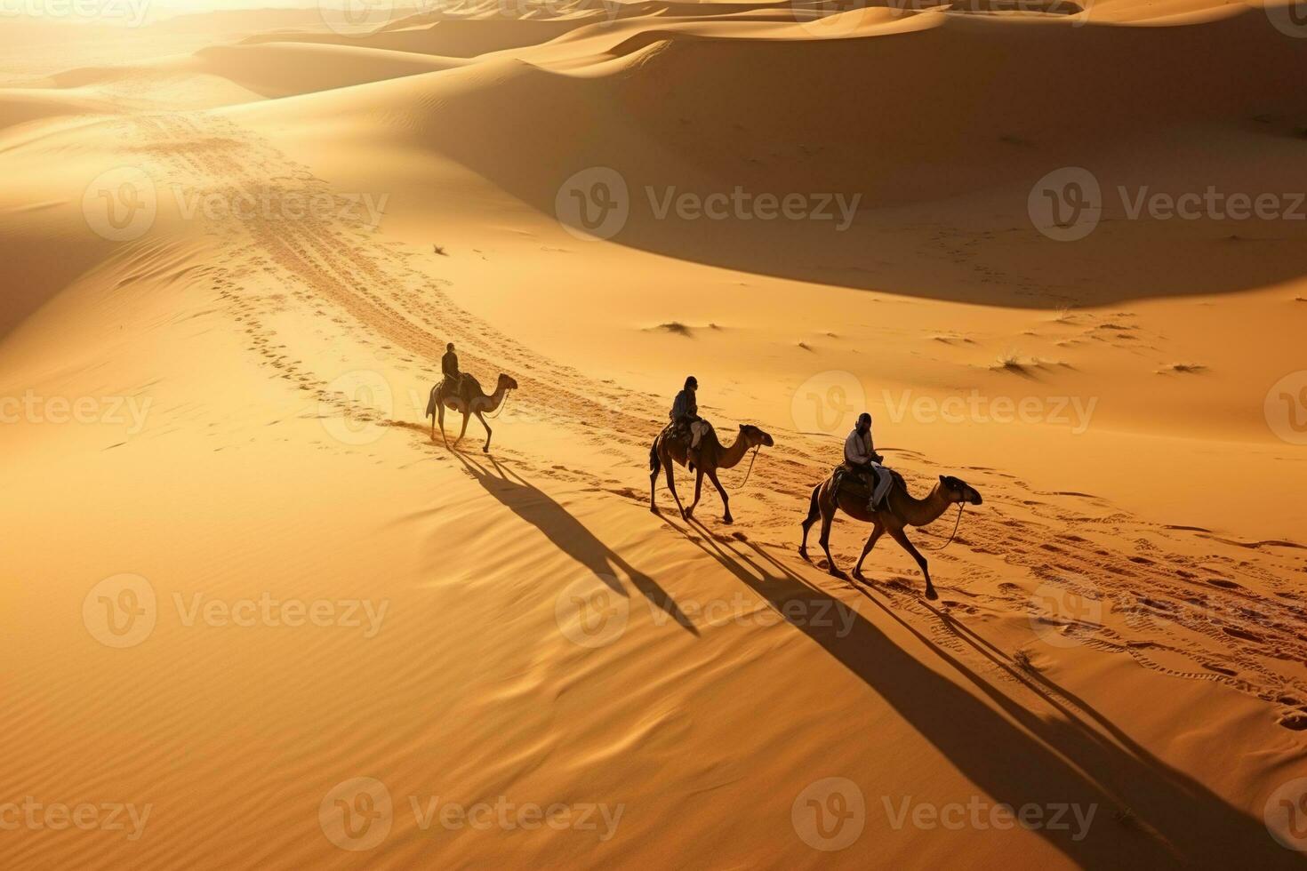 People on camels move through the desert. Beautiful desert landscape, top view. Generated by artificial intelligence photo