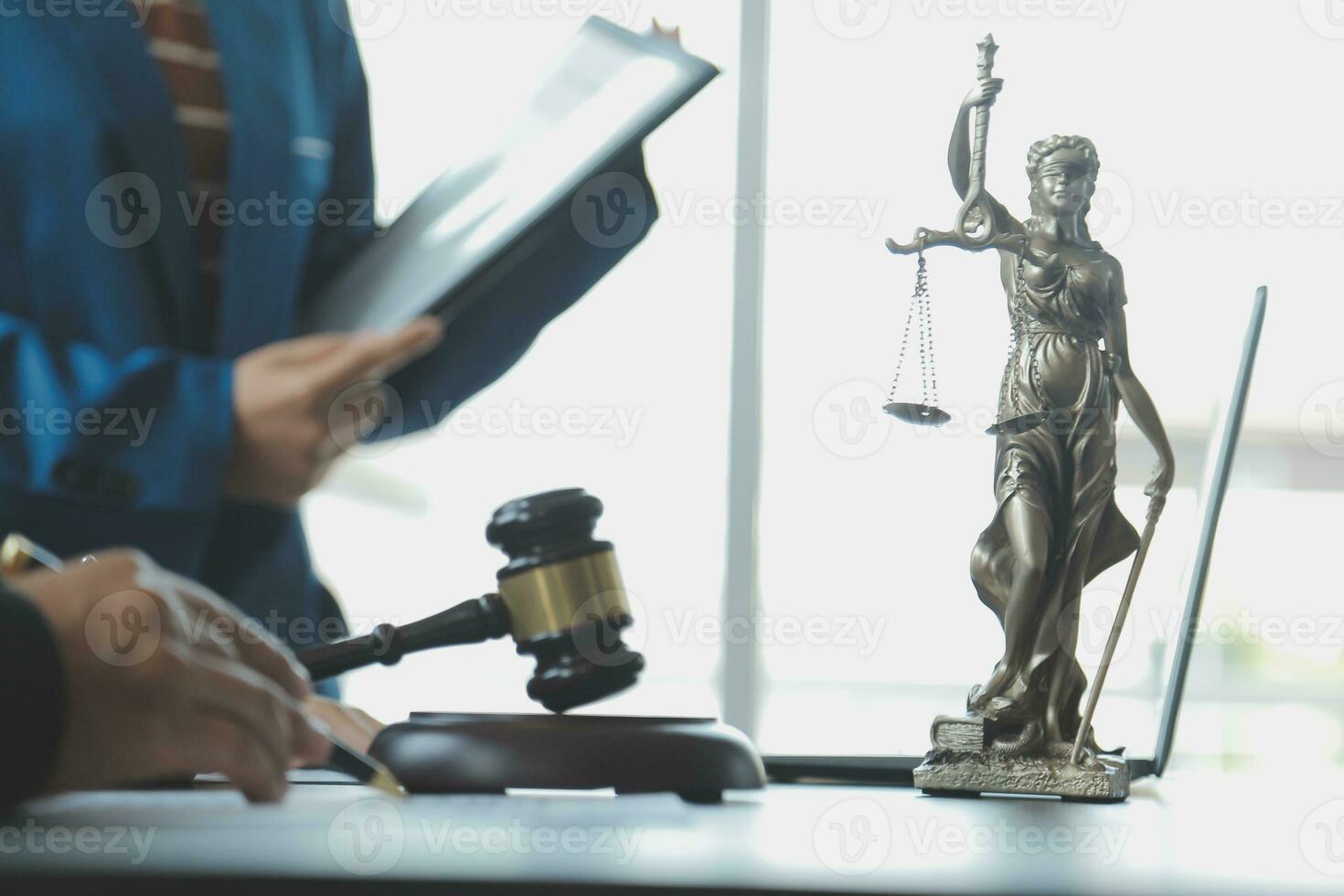 Business and lawyers discussing contract papers with brass scale on desk in office. Law, legal services, advice, justice and law concept picture with film grain effect photo