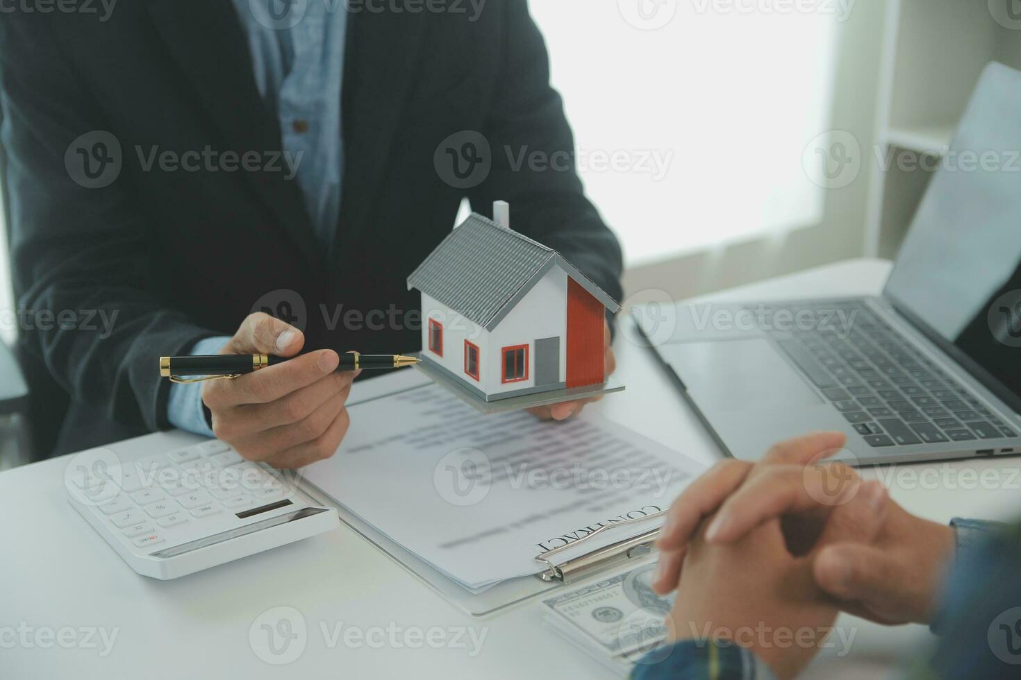 Real estate agent and customer signing contract to buy house, insurance or loan real estate.rent a house,get insurance or loan real estate or property. photo