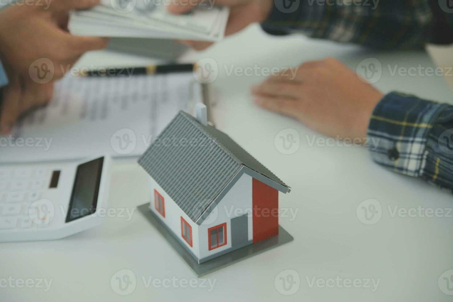 Real estate agent and customer signing contract to buy house, insurance or loan real estate.rent a house,get insurance or loan real estate or property. photo