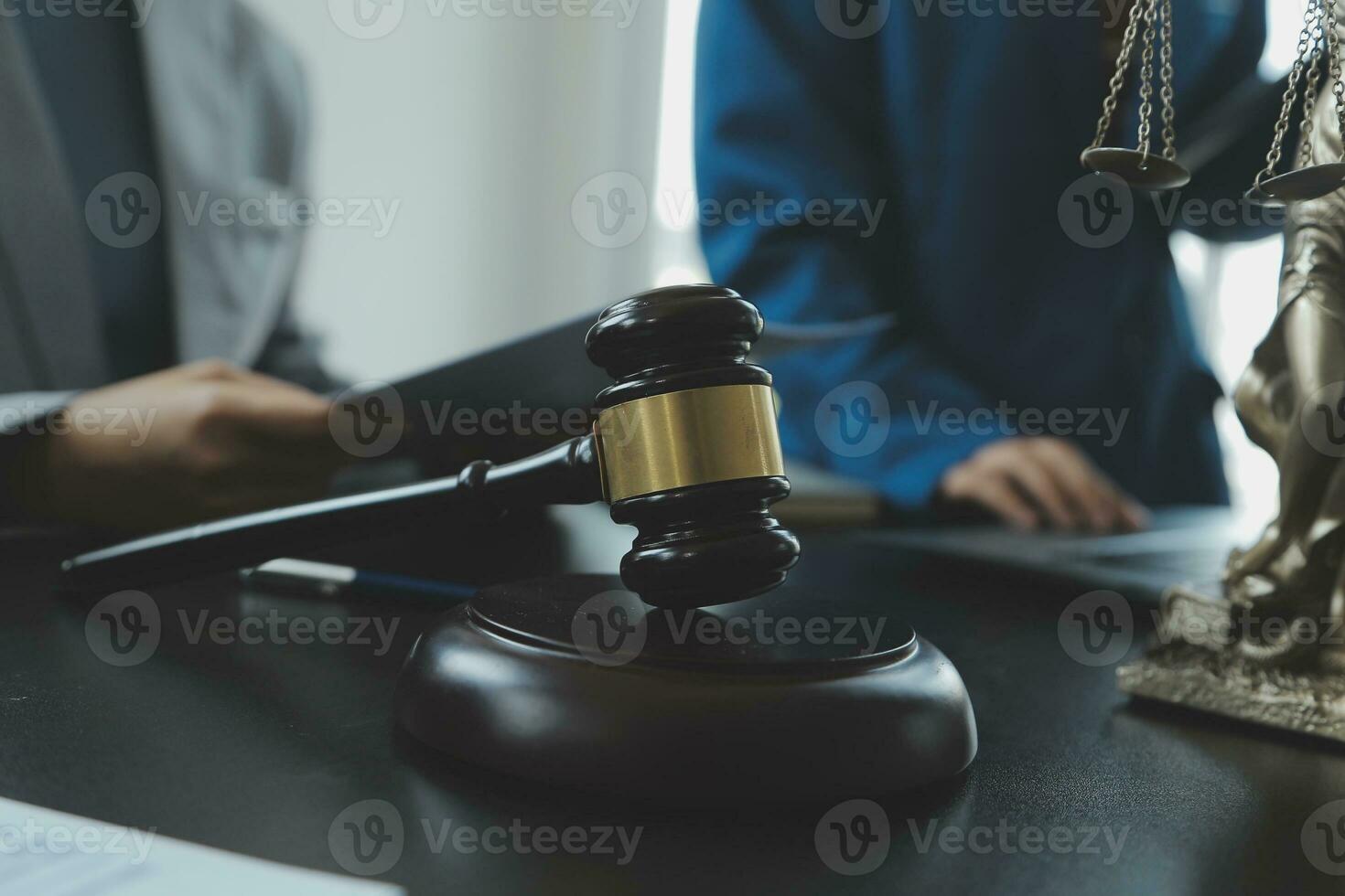 Business and lawyers discussing contract papers with brass scale on desk in office. Law, legal services, advice, justice and law concept picture with film grain effect photo