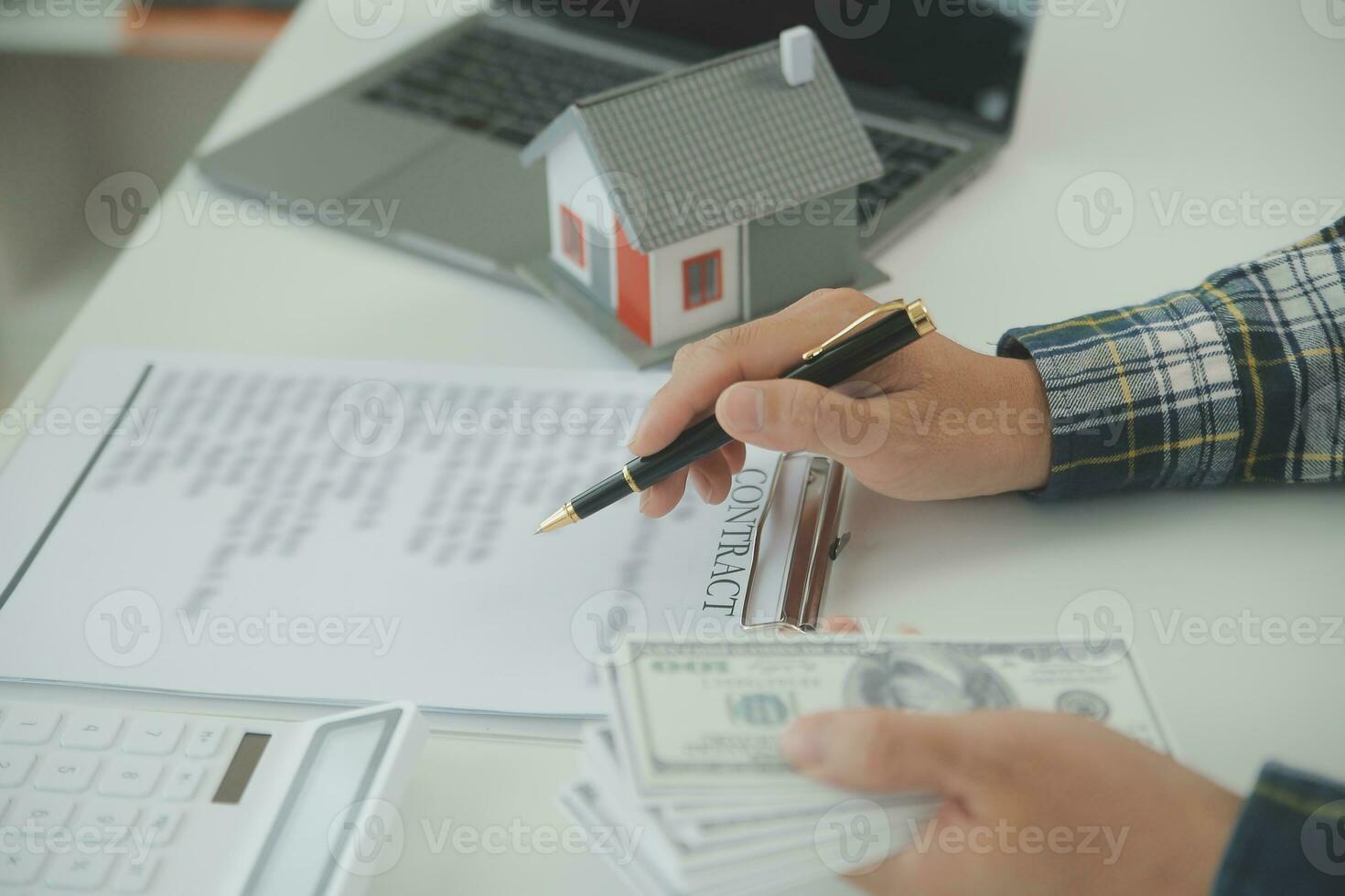 Real estate agent and customer signing contract to buy house, insurance or loan real estate.rent a house,get insurance or loan real estate or property. photo