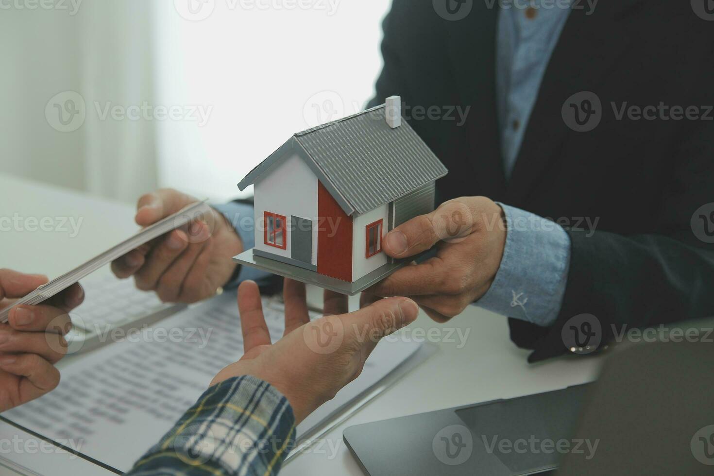 Real estate agent and customer signing contract to buy house, insurance or loan real estate.rent a house,get insurance or loan real estate or property. photo