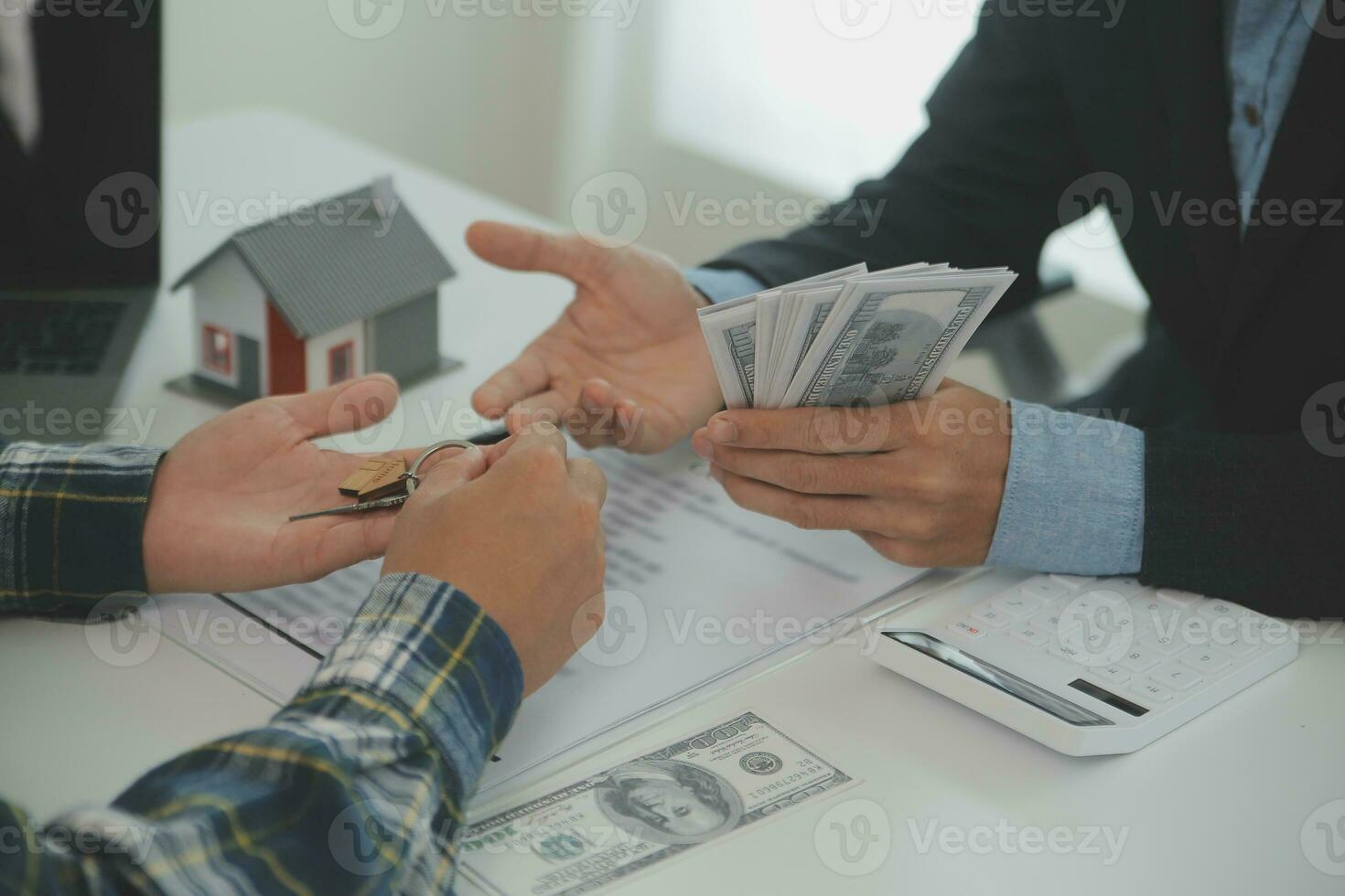 Real estate agent and customer signing contract to buy house, insurance or loan real estate.rent a house,get insurance or loan real estate or property. photo