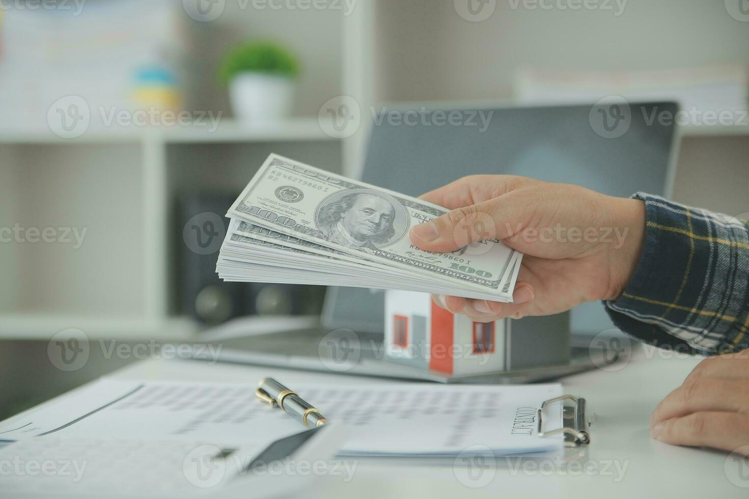 Real estate agent and customer signing contract to buy house, insurance or loan real estate.rent a house,get insurance or loan real estate or property. photo