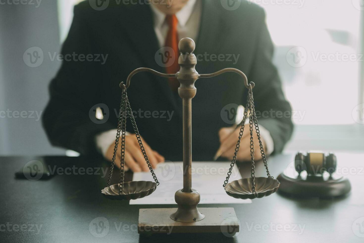 Business and lawyers discussing contract papers with brass scale on desk in office. Law, legal services, advice, justice and law concept picture with film grain effect photo