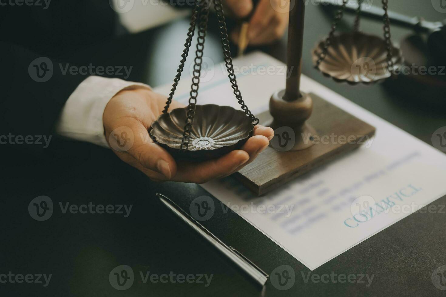Business and lawyers discussing contract papers with brass scale on desk in office. Law, legal services, advice, justice and law concept picture with film grain effect photo