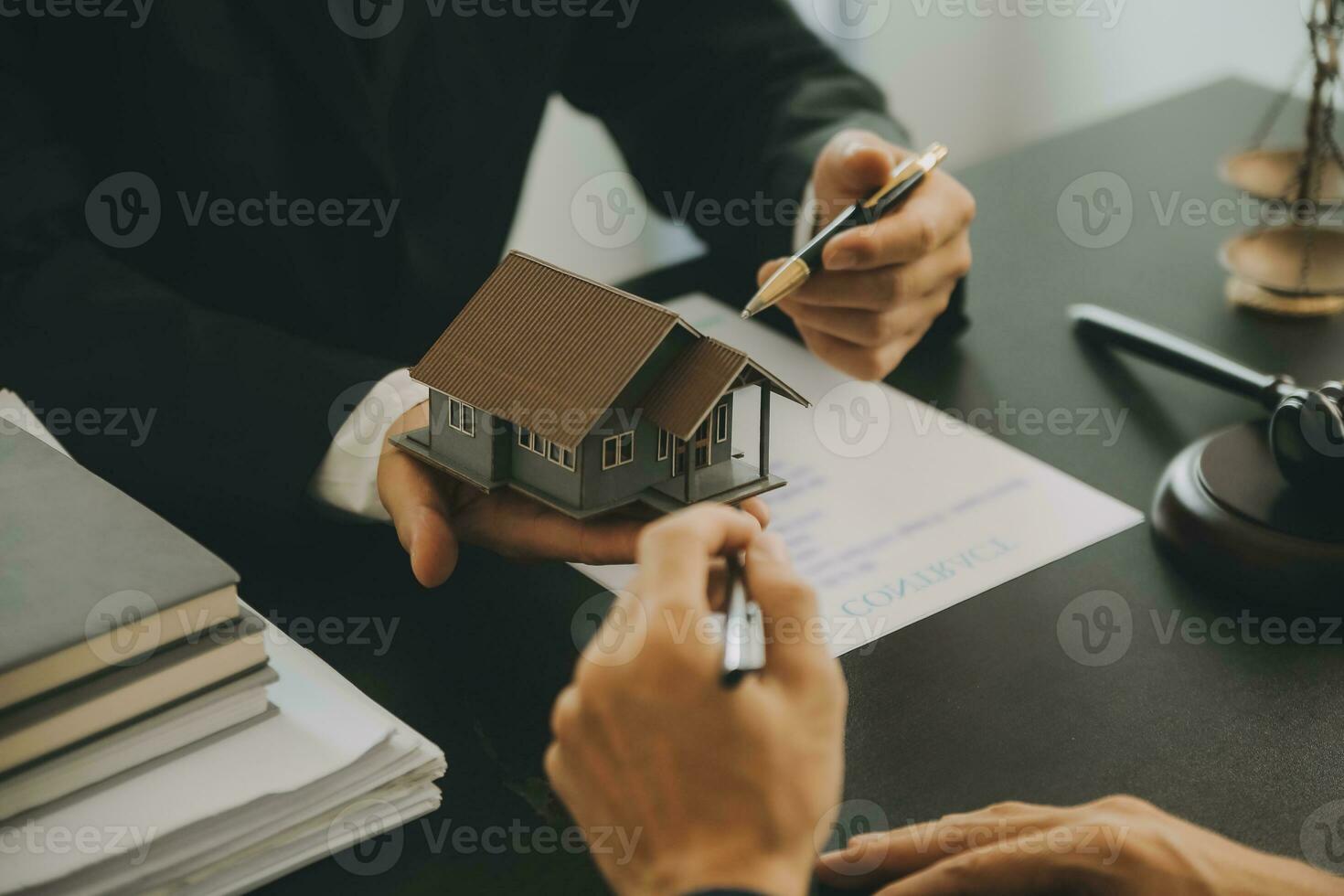 Business and lawyers discussing contract papers with brass scale on desk in office. Law, legal services, advice, justice and law concept picture with film grain effect photo