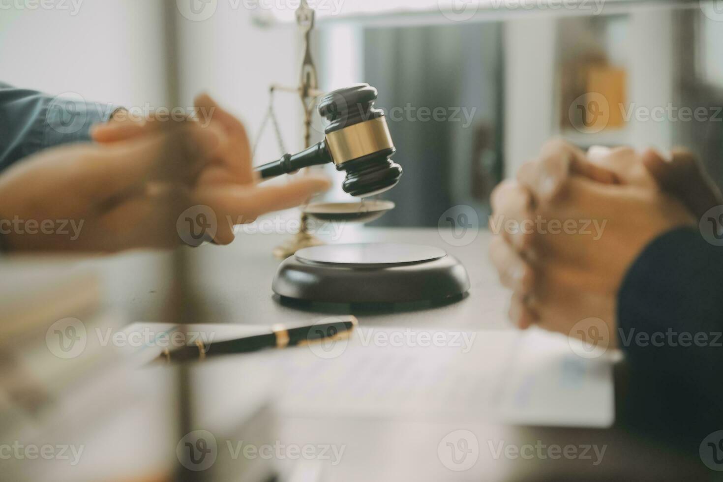 Business and lawyers discussing contract papers with brass scale on desk in office. Law, legal services, advice, justice and law concept picture with film grain effect photo