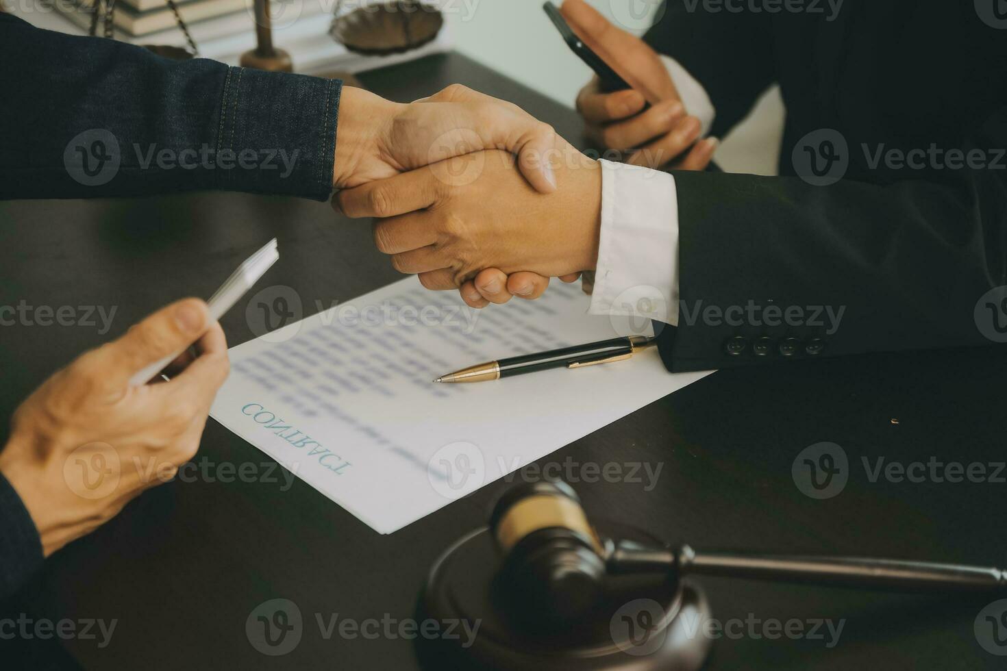 Business and lawyers discussing contract papers with brass scale on desk in office. Law, legal services, advice, justice and law concept picture with film grain effect photo