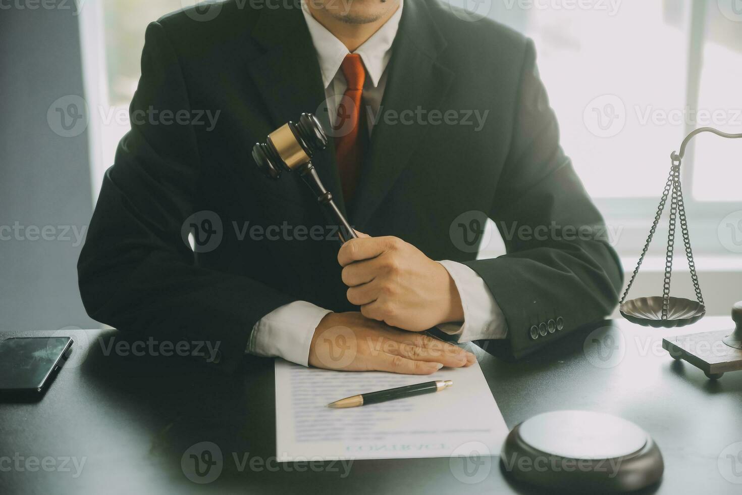Business and lawyers discussing contract papers with brass scale on desk in office. Law, legal services, advice, justice and law concept picture with film grain effect photo