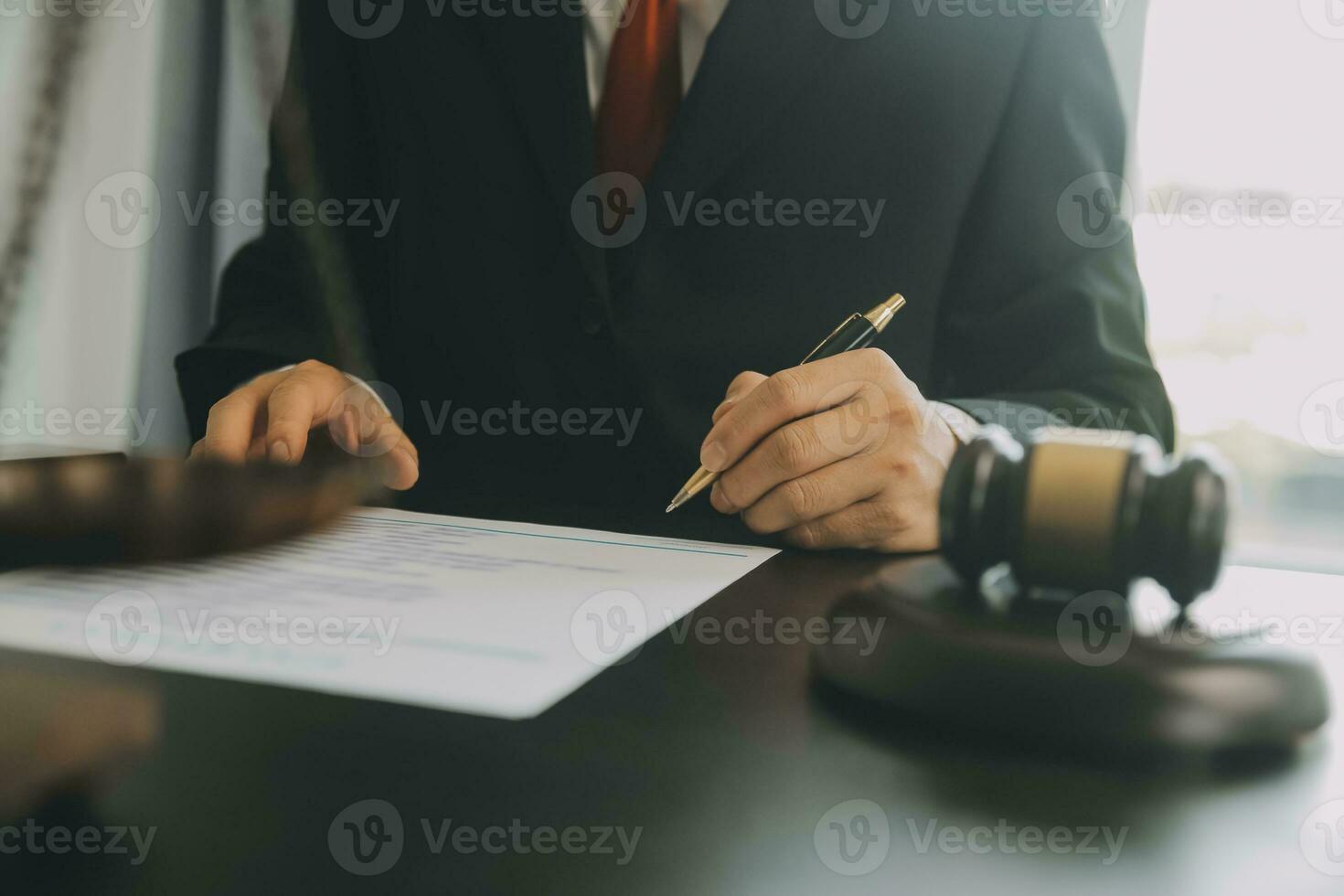 Business and lawyers discussing contract papers with brass scale on desk in office. Law, legal services, advice, justice and law concept picture with film grain effect photo