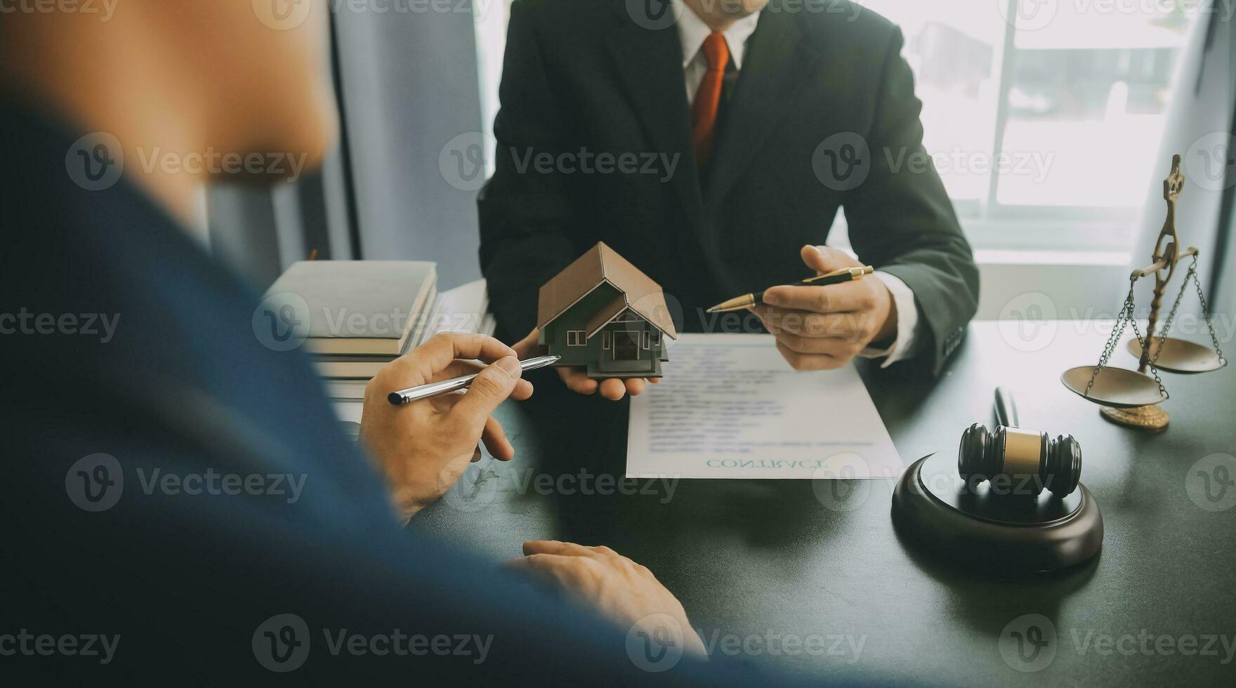 Business and lawyers discussing contract papers with brass scale on desk in office. Law, legal services, advice, justice and law concept picture with film grain effect photo